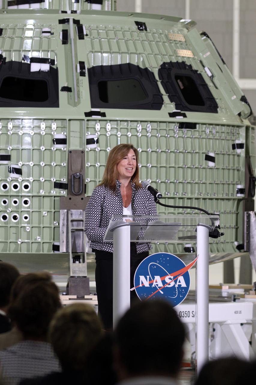CAPE CANAVERAL, Fla. – NASA Deputy Administrator Lori Garver addresses the audience assembled in Kennedy Space Center's Operations and Checkout Building high bay for an event marking the arrival of NASA's first space-bound Orion capsule in Florida.    Slated for Exploration Flight Test-1, an uncrewed mission planned for 2014, the capsule will travel farther into space than any human spacecraft has gone in more than 40 years. The capsule was shipped to Kennedy from NASA's Michoud Assembly Facility in New Orleans where the crew module pressure vessel was built. The Orion production team will prepare the module for flight at Kennedy by installing heat-shielding thermal protection systems, avionics and other subsystems. For more information, visit http://www.nasa.gov/orion.  Photo credit: NASA/Kim Shiflett
