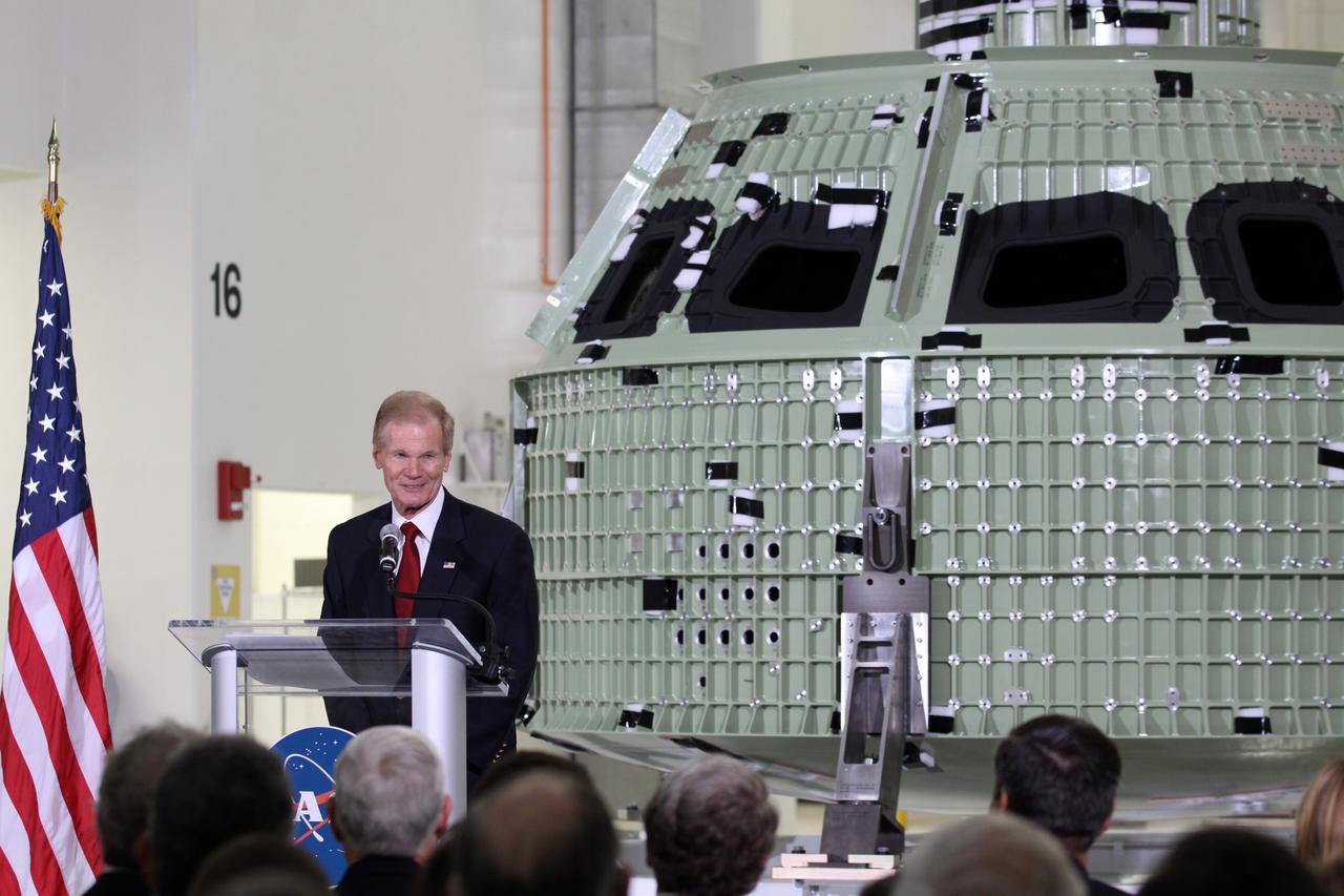 CAPE CANAVERAL, Fla. – U.S. Senator Bill Nelson addresses the audience assembled in Kennedy Space Center's Operations and Checkout Building high bay for an event marking the arrival of NASA's first space-bound Orion capsule in Florida.    Slated for Exploration Flight Test-1, an uncrewed mission planned for 2014, the capsule will travel farther into space than any human spacecraft has gone in more than 40 years. The capsule was shipped to Kennedy from NASA's Michoud Assembly Facility in New Orleans where the crew module pressure vessel was built. The Orion production team will prepare the module for flight at Kennedy by installing heat-shielding thermal protection systems, avionics and other subsystems. For more information, visit http://www.nasa.gov/orion.  Photo credit: NASA/Kim Shiflett