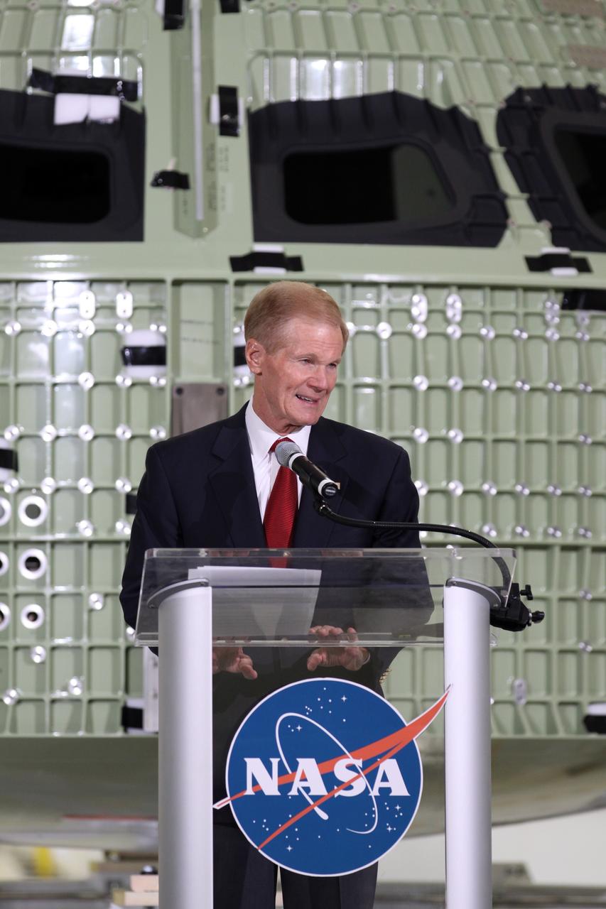 CAPE CANAVERAL, Fla. – U.S. Senator Bill Nelson addresses the audience assembled in Kennedy Space Center's Operations and Checkout Building high bay for an event marking the arrival of NASA's first space-bound Orion capsule in Florida.    Slated for Exploration Flight Test-1, an uncrewed mission planned for 2014, the capsule will travel farther into space than any human spacecraft has gone in more than 40 years. The capsule was shipped to Kennedy from NASA's Michoud Assembly Facility in New Orleans where the crew module pressure vessel was built. The Orion production team will prepare the module for flight at Kennedy by installing heat-shielding thermal protection systems, avionics and other subsystems. For more information, visit http://www.nasa.gov/orion.  Photo credit: NASA/Kim Shiflett