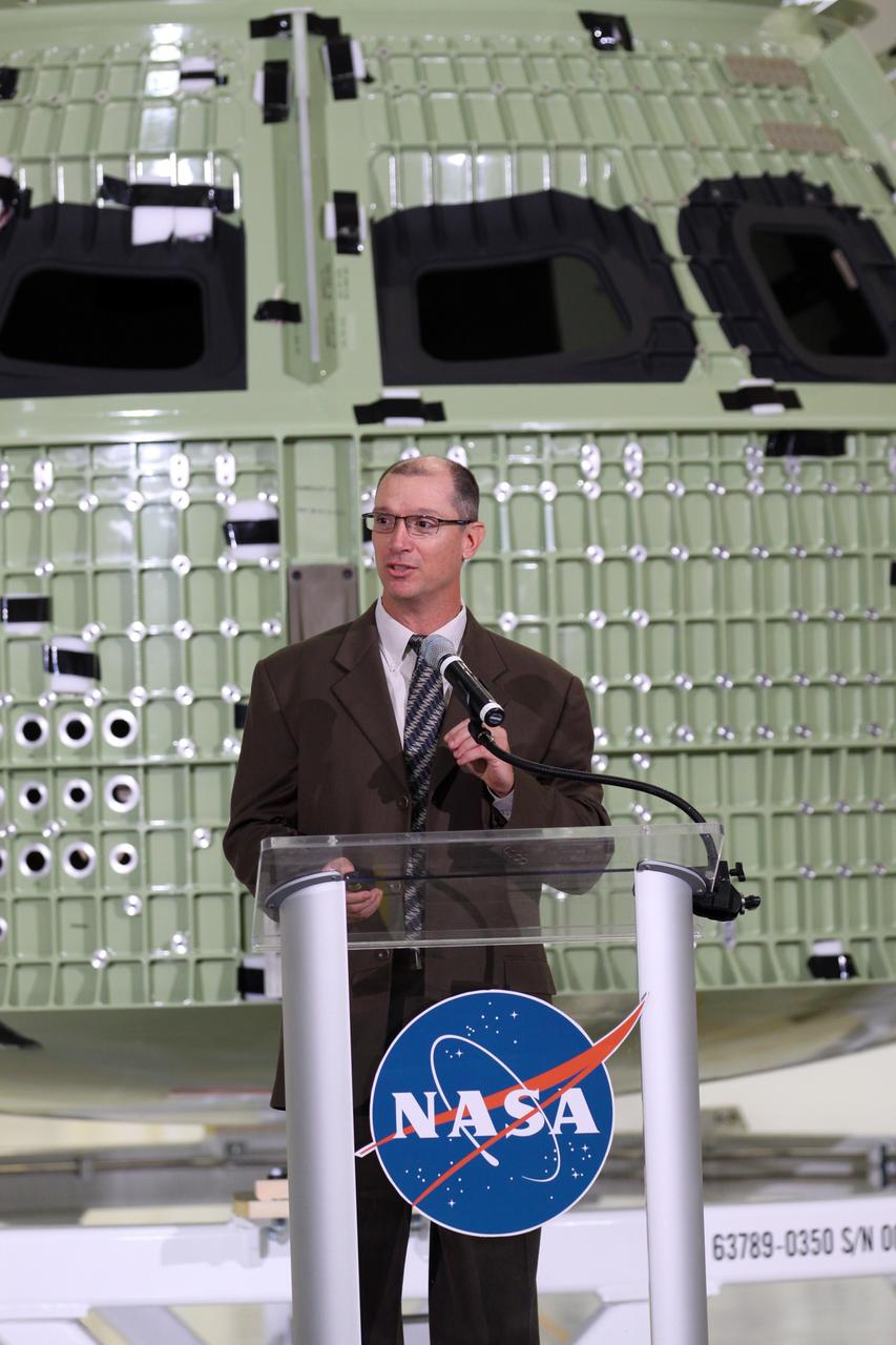 CAPE CANAVERAL, Fla. – Pepper Phillips, program manager for NASA's Ground Systems Development and Operations, addresses the audience assembled in Kennedy Space Center's Operations and Checkout Building high bay for an event marking the arrival of NASA's first space-bound Orion capsule in Florida.    Slated for Exploration Flight Test-1, an uncrewed mission planned for 2014, the capsule will travel farther into space than any human spacecraft has gone in more than 40 years. The capsule was shipped to Kennedy from NASA's Michoud Assembly Facility in New Orleans where the crew module pressure vessel was built. The Orion production team will prepare the module for flight at Kennedy by installing heat-shielding thermal protection systems, avionics and other subsystems. For more information, visit http://www.nasa.gov/orion.  Photo credit: NASA/Kim Shiflett