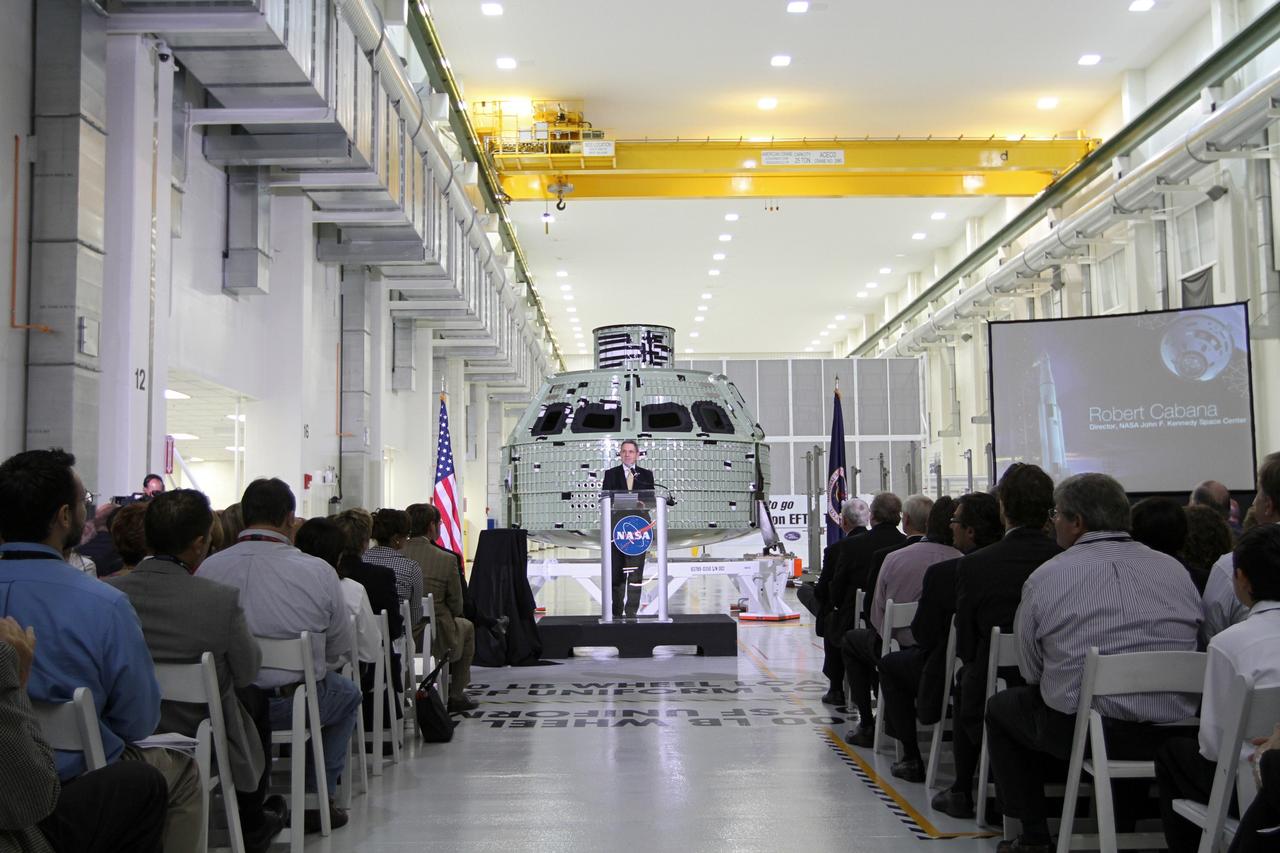 CAPE CANAVERAL, Fla. – NASA Kennedy Space Center Director Robert Cabana addresses the audience assembled in Kennedy's Operations and Checkout Building high bay for an event marking the arrival of NASA's first space-bound Orion capsule in Florida.      Slated for Exploration Flight Test-1, an uncrewed mission planned for 2014, the capsule will travel farther into space than any human spacecraft has gone in more than 40 years. The capsule was shipped to Kennedy from NASA's Michoud Assembly Facility in New Orleans where the crew module pressure vessel was built. The Orion production team will prepare the module for flight at Kennedy by installing heat-shielding thermal protection systems, avionics and other subsystems. For more information, visit http://www.nasa.gov/orion.  Photo credit: NASA/Kim Shiflett