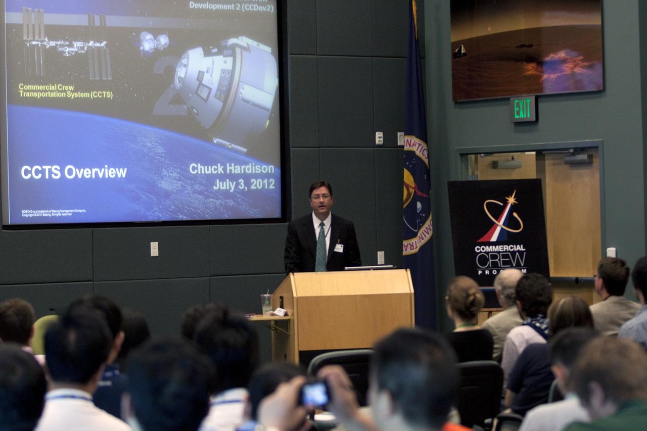 CAPE CANAVERAL, Fla. – Chuck Hardison of Boeing provides a Commercial Crew Transportation System overview for participants of the International Space University session on July 3 in Operations Support Building II at the Kennedy Space Center, Fla.      The International Space University is a nine-week intensive course designed for post-graduate university students and professionals during the summer. The program is hosted by a different country each year, providing a unique educational experience for participants from around the world. NASA Kennedy Space Center and the Florida Institute of Technology are co-hosting this year's event which runs from June 4 to Aug. 3. There are about 125 participants representing 31 countries. For more information, visit http://www.isunet.edu Photo credit: NASA/Jim Grossmann