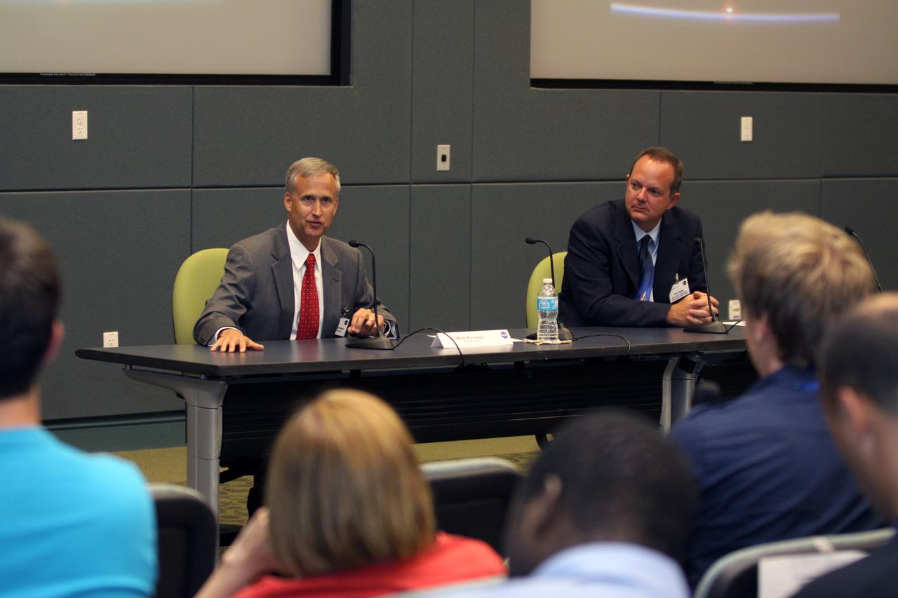 CAPE CANAVERAL, Fla. - From the left, Mark Bontrager, vice president of Spaceport Operations at Space Florida, and Tom Engler, NASA's deputy manager of the Kennedy Space Center Planning and Development Office, participate in a panel discussion during an International Space University session in Kennedy's Operations Support Building II on July 3.    The International Space University is a nine-week intensive course designed for post-graduate university students and professionals during the summer. The program is hosted by a different country each year, providing a unique educational experience for participants from around the world. NASA Kennedy Space Center and the Florida Institute of Technology are co-hosting this year's event which runs from June 4 to Aug. 3. There are about 125 participants representing 31 countries. For more information, visit http://www.isunet.edu. Photo credit: NASA/Kim Shiflett