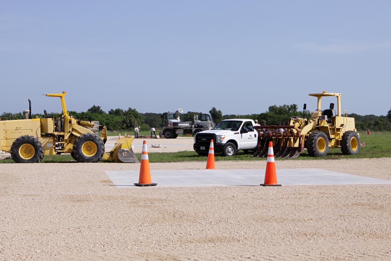 CAPE CANAVERAL, Fla. – Steady progress is made on the construction of the hazard field for the Project Morpheus lander near the Shuttle Landing Facility, or SLF, at NASA’s Kennedy Space Center in Florida. Testing of the prototype lander has been ongoing at NASA’s Johnson Space Center in Houston in preparation for its first free flight. The SLF will provide the lander with the kind of field necessary for realistic testing, complete with rocks, craters and hazards to avoid. Morpheus utilizes an autonomous landing and hazard avoidance technology, or ALHAT, payload that will allow it to navigate to clear landing sites amidst rocks, craters and other hazards during its descent. Project Morpheus is one of 20 small projects comprising the Advanced Exploration Systems, or AES, program in NASA’s Human Exploration and Operations Mission Directorate. AES projects pioneer new approaches for rapidly developing prototype systems, demonstrating key capabilities and validating operational concepts for future human missions beyond Earth orbit. For more information on Project Morpheus, visit http://www.nasa.gov/centers/johnson/exploration/morpheus/index.html. Photo credit: NASA/Kim Shiflett