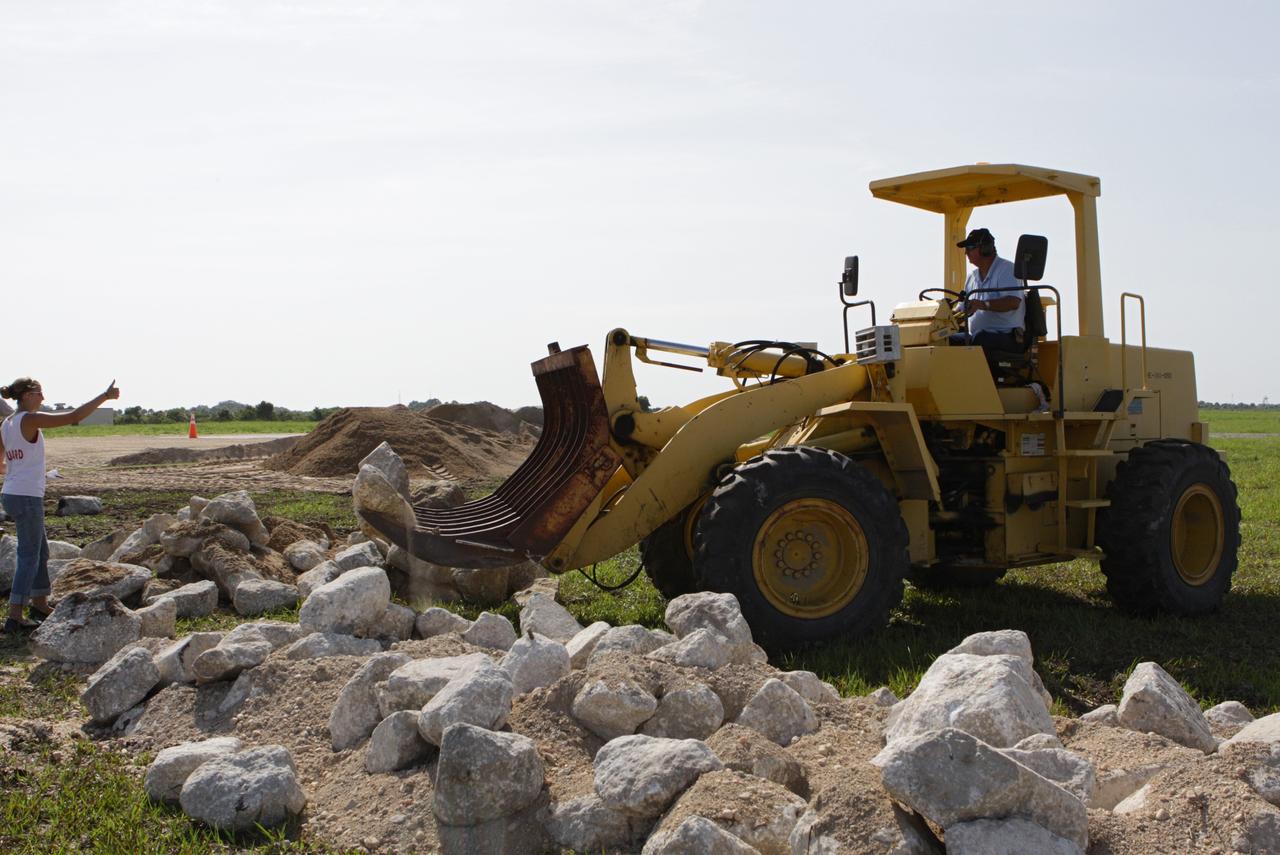CAPE CANAVERAL, Fla. – Steady progress is made on the construction of the hazard field for the Project Morpheus lander near the Shuttle Landing Facility, or SLF, at NASA’s Kennedy Space Center in Florida. Testing of the prototype lander has been ongoing at NASA’s Johnson Space Center in Houston in preparation for its first free flight. The SLF will provide the lander with the kind of field necessary for realistic testing, complete with rocks, craters and hazards to avoid. Morpheus utilizes an autonomous landing and hazard avoidance technology, or ALHAT, payload that will allow it to navigate to clear landing sites amidst rocks, craters and other hazards during its descent. Project Morpheus is one of 20 small projects comprising the Advanced Exploration Systems, or AES, program in NASA’s Human Exploration and Operations Mission Directorate. AES projects pioneer new approaches for rapidly developing prototype systems, demonstrating key capabilities and validating operational concepts for future human missions beyond Earth orbit. For more information on Project Morpheus, visit http://www.nasa.gov/centers/johnson/exploration/morpheus/index.html. Photo credit: NASA/Kim Shiflett