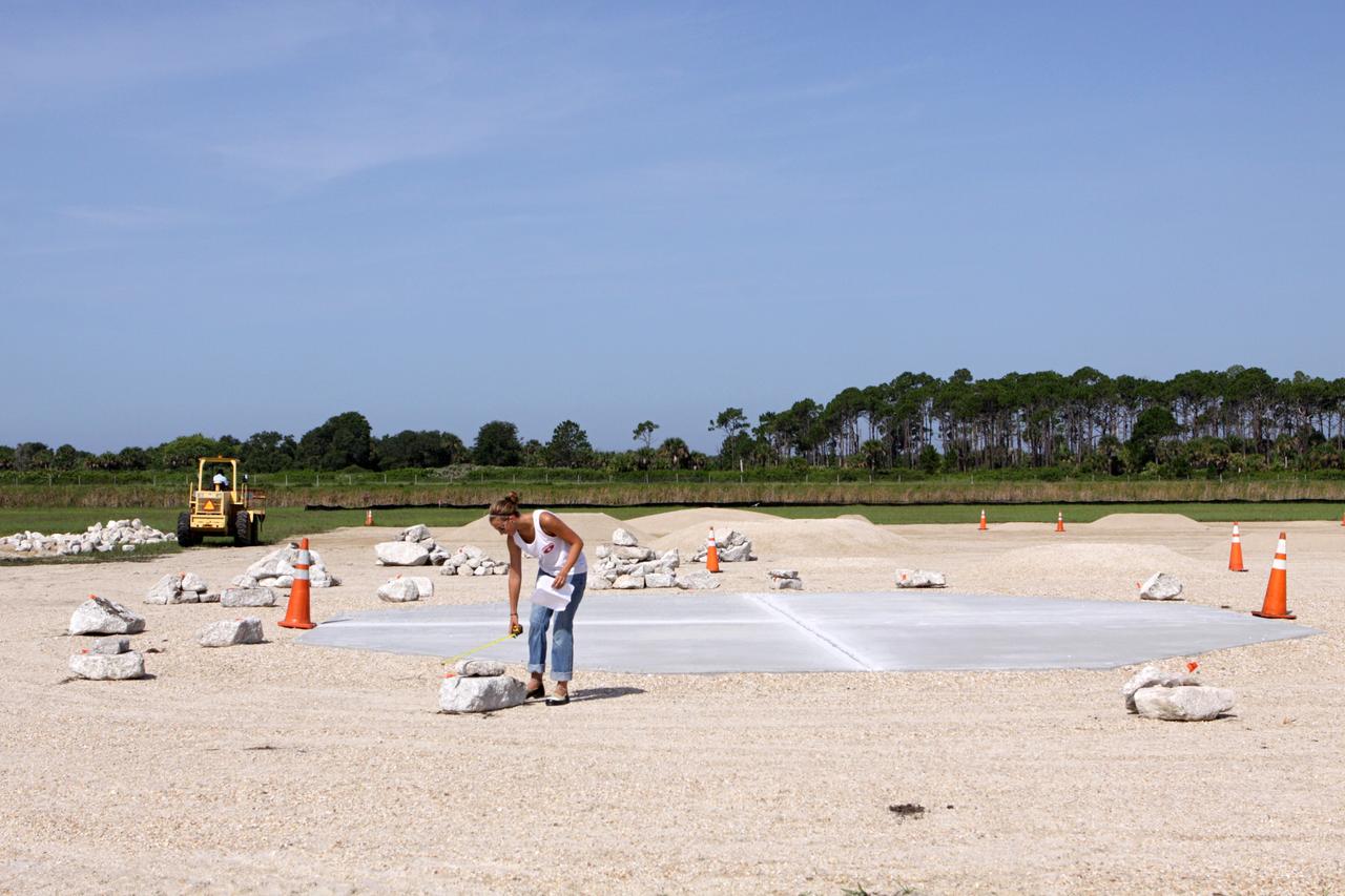 CAPE CANAVERAL, Fla. – Steady progress is made on the construction of the hazard field for the Project Morpheus lander near the Shuttle Landing Facility, or SLF, at NASA’s Kennedy Space Center in Florida. Testing of the prototype lander has been ongoing at NASA’s Johnson Space Center in Houston in preparation for its first free flight. The SLF will provide the lander with the kind of field necessary for realistic testing, complete with rocks, craters and hazards to avoid. Morpheus utilizes an autonomous landing and hazard avoidance technology, or ALHAT, payload that will allow it to navigate to clear landing sites amidst rocks, craters and other hazards during its descent. Project Morpheus is one of 20 small projects comprising the Advanced Exploration Systems, or AES, program in NASA’s Human Exploration and Operations Mission Directorate. AES projects pioneer new approaches for rapidly developing prototype systems, demonstrating key capabilities and validating operational concepts for future human missions beyond Earth orbit. For more information on Project Morpheus, visit http://www.nasa.gov/centers/johnson/exploration/morpheus/index.html. Photo credit: NASA/Kim Shiflett