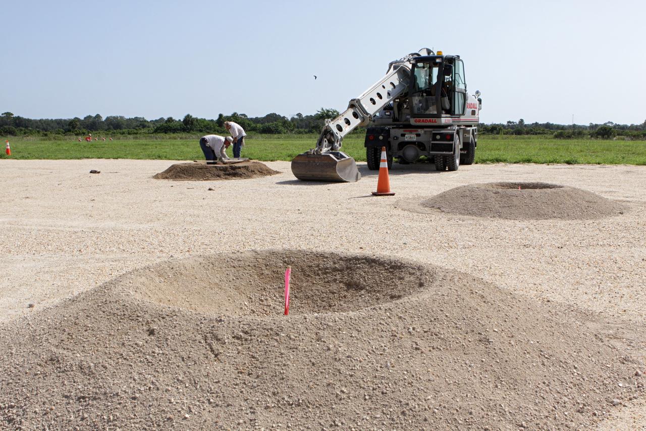 CAPE CANAVERAL, Fla. – Steady progress is made on the construction of the hazard field for the Project Morpheus lander near the Shuttle Landing Facility, or SLF, at NASA’s Kennedy Space Center in Florida. Testing of the prototype lander has been ongoing at NASA’s Johnson Space Center in Houston in preparation for its first free flight. The SLF will provide the lander with the kind of field necessary for realistic testing, complete with rocks, craters and hazards to avoid. Morpheus utilizes an autonomous landing and hazard avoidance technology, or ALHAT, payload that will allow it to navigate to clear landing sites amidst rocks, craters and other hazards during its descent. Project Morpheus is one of 20 small projects comprising the Advanced Exploration Systems, or AES, program in NASA’s Human Exploration and Operations Mission Directorate. AES projects pioneer new approaches for rapidly developing prototype systems, demonstrating key capabilities and validating operational concepts for future human missions beyond Earth orbit. For more information on Project Morpheus, visit http://www.nasa.gov/centers/johnson/exploration/morpheus/index.html. Photo credit: NASA/Kim Shiflett
