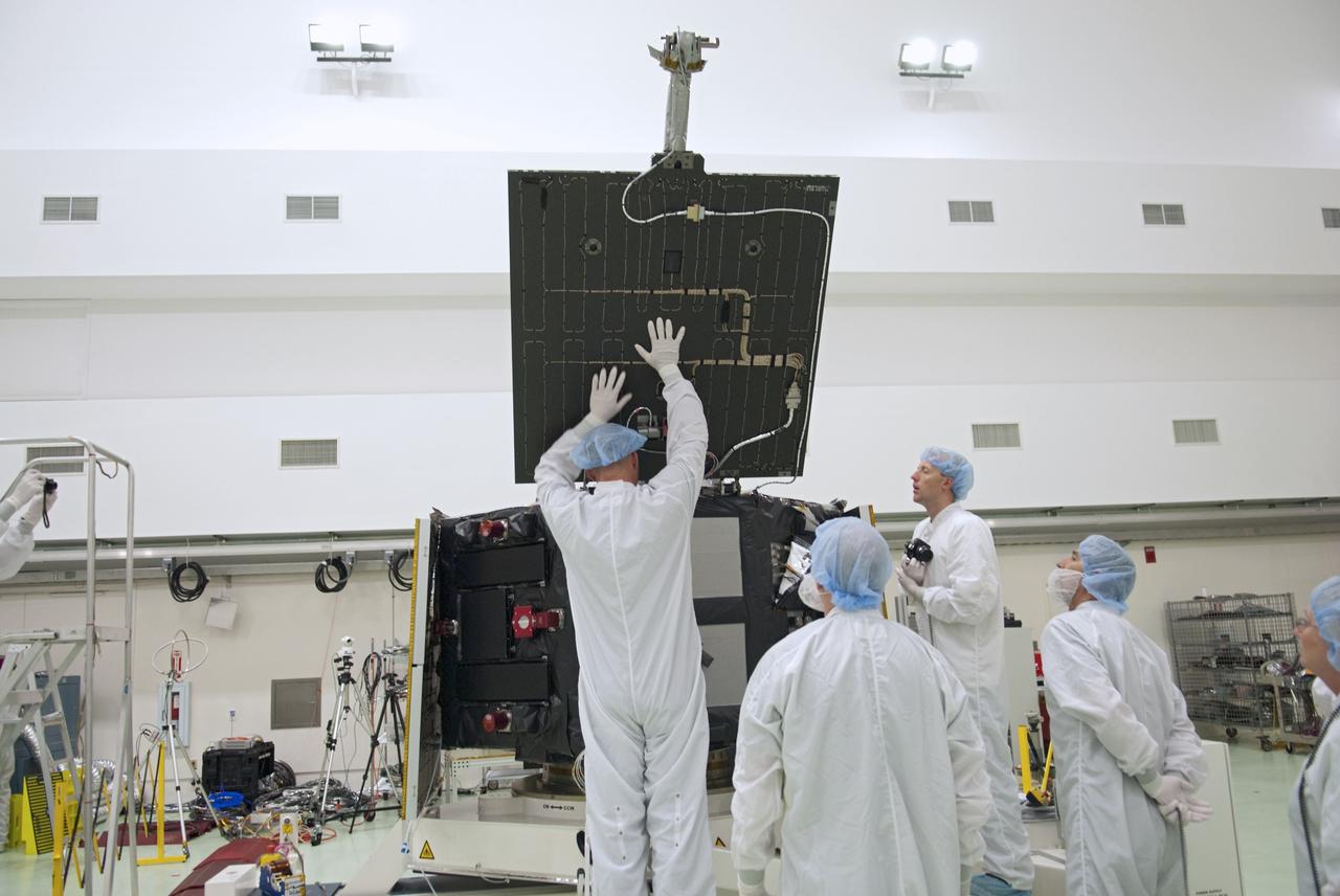 CAPE CANAVERAL, Fla. - Inside the Astrotech payload processing facility near NASA’s Kennedy Space Center in Florida, technicians deploy one of four solar arrays of the Radiation Belt Storm Probes, or RBSP, spacecraft A. Deploying these arrays is standard procedure to ensure they work properly on Earth before they head into space. NASA’s RBSP mission will help us understand the sun’s influence on Earth and near-Earth space by studying the Earth’s radiation belts on various scales of space and time. As the spacecraft orbits Earth, the panels will continuously face the sun to provide constant power to its instruments. RBSP will begin its mission of exploration of Earth’s Van Allen radiation belts and the extremes of space weather after its launch aboard a United Launch Alliance Atlas V rocket. Launch is targeted for Aug. 23. For more information, visit http://www.nasa.gov/rbsp. Photo credit: NASA/Charisse Nahser