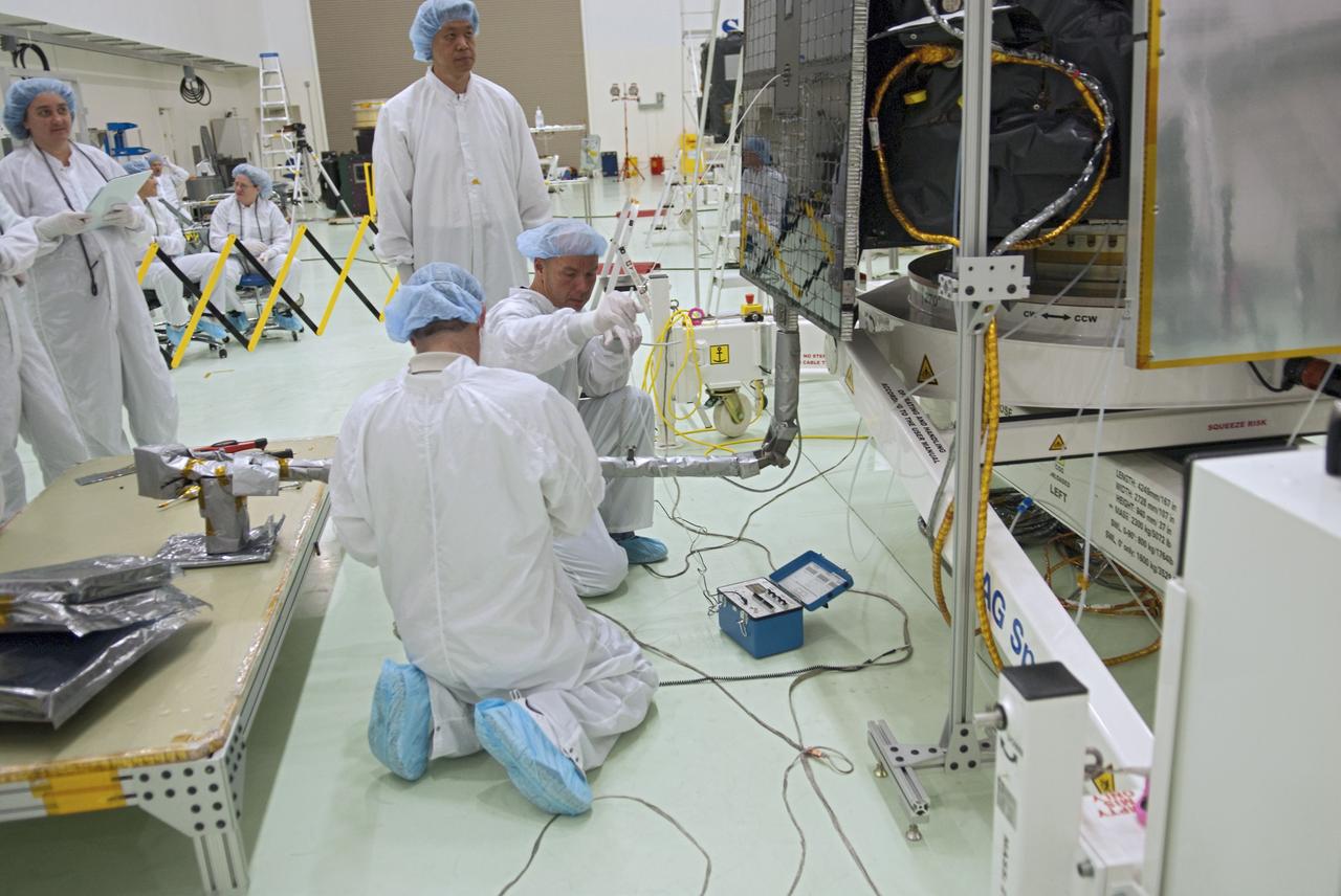 CAPE CANAVERAL, Fla. - Inside the Astrotech payload processing facility near NASA’s Kennedy Space Center in Florida, technicians deploy the magnetometer boom of the Radiation Belt Storm Probes, or RBSP, spacecraft A. Deploying this instrument is standard procedure to ensure it will work properly on Earth before it heads into space. NASA’s RBSP mission will help us understand the sun’s influence on Earth and near-Earth space by studying the Earth’s radiation belts on various scales of space and time. The boom will provide data of the electric fields that energize radiation particles and modify the structure of the inner magnetosphere.        RBSP will begin its mission of exploration of Earth’s Van Allen radiation belts and the extremes of space weather after its launch aboard a United Launch Alliance Atlas V rocket. Launch is targeted for Aug. 23. For more information, visit http://www.nasa.gov/rbsp. Photo credit: NASA/Charisse Nahser