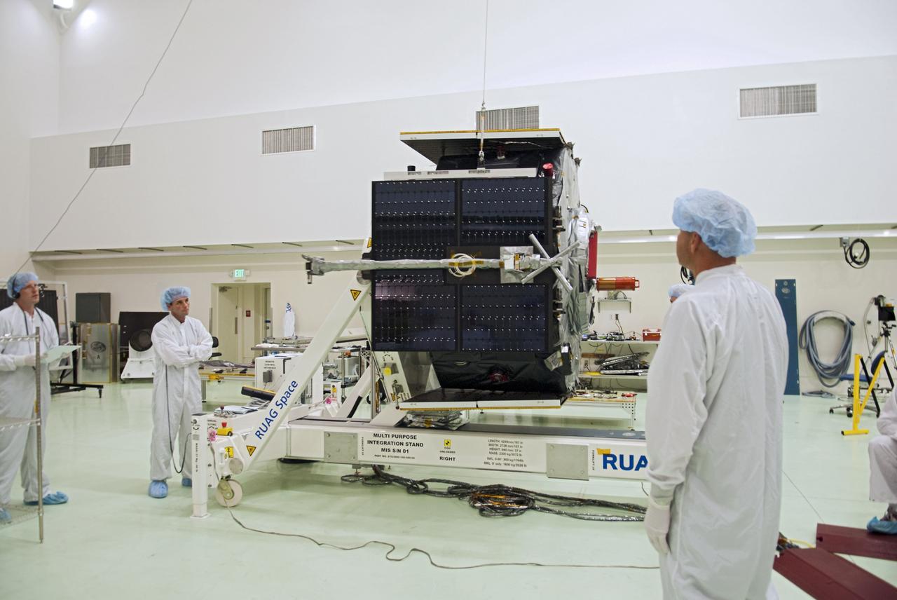 CAPE CANAVERAL, Fla. - Inside the Astrotech payload processing facility near NASA’s Kennedy Space Center in Florida, technicians deploy one of four solar panels on the Radiation Belt Storm Probes, or RBSP, spacecraft A. Deploying these arrays is standard procedure to ensure they work properly on Earth before they head into space. NASA’s RBSP mission will help us understand the sun’s influence on Earth and near-Earth space by studying the Earth’s radiation belts on various scales of space and time. As the spacecraft orbits Earth, the panels will continuously face the sun to provide constant power to its instruments. RBSP will begin its mission of exploration of Earth’s Van Allen radiation belts and the extremes of space weather after its launch aboard a United Launch Alliance Atlas V rocket. Launch is targeted for Aug. 23. For more information, visit http://www.nasa.gov/rbsp. Photo credit: NASA/Charisse Nahser