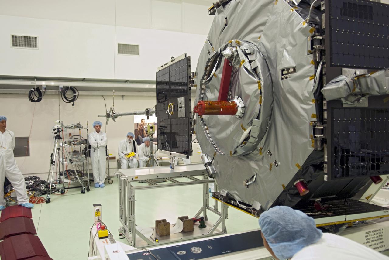 CAPE CANAVERAL, Fla. - Inside the Astrotech payload processing facility near NASA’s Kennedy Space Center in Florida, technicians deploy one of four solar panels on the Radiation Belt Storm Probes, or RBSP, spacecraft A. Deploying these arrays is standard procedure to ensure they work properly on Earth before they head into space. NASA’s RBSP mission will help us understand the sun’s influence on Earth and near-Earth space by studying the Earth’s radiation belts on various scales of space and time. As the spacecraft orbits Earth, the panels will continuously face the sun to provide constant power to its instruments. RBSP will begin its mission of exploration of Earth’s Van Allen radiation belts and the extremes of space weather after its launch aboard a United Launch Alliance Atlas V rocket. Launch is targeted for Aug. 23. For more information, visit http://www.nasa.gov/rbsp. Photo credit: NASA/Charisse Nahser