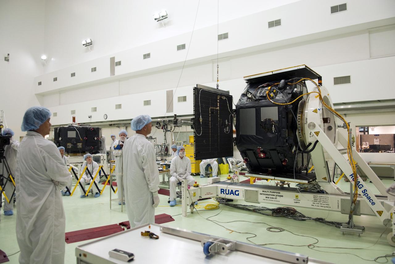 CAPE CANAVERAL, Fla. - Inside the Astrotech payload processing facility near NASA’s Kennedy Space Center in Florida, technicians begin to deploy the solar arrays and magnetometer boom of the Radiation Belt Storm Probes, or RBSP, spacecraft A. Deploying these components are standard procedure to ensure they work properly on Earth before they head into space. NASA’s RBSP mission will help us understand the sun’s influence on Earth and near-Earth space by studying the Earth’s radiation belts on various scales of space and time. As the spacecraft orbits Earth, the four solar panels will continuously face the sun to provide constant power to its instruments. The boom will provide data of the electric fields that energize radiation particles and modify the structure of the inner magnetosphere. RBSP will begin its mission of exploration of Earth’s Van Allen radiation belts and the extremes of space weather after its launch aboard a United Launch Alliance Atlas V rocket. Launch is targeted for Aug. 23. For more information, visit http://www.nasa.gov/rbsp. Photo credit: NASA/Charisse Nahser