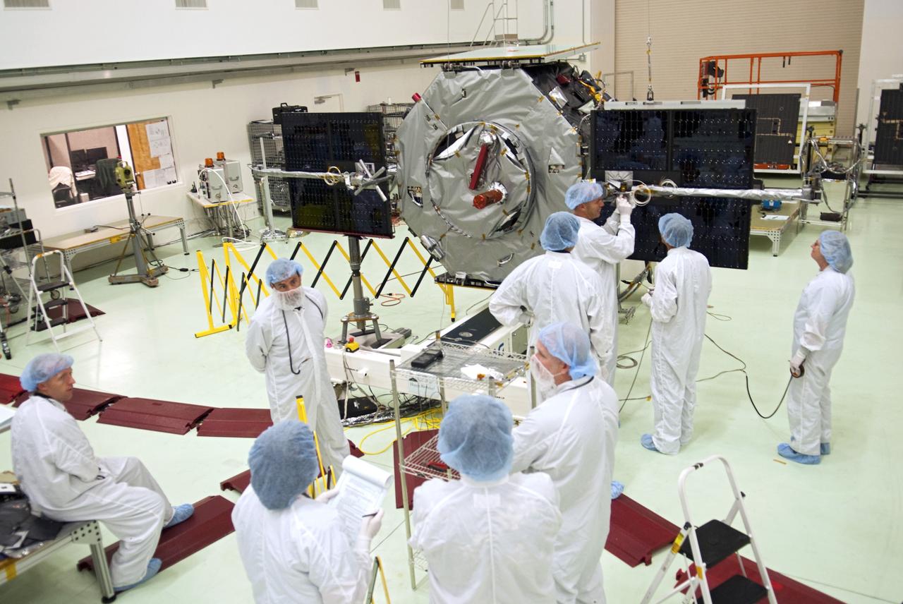 CAPE CANAVERAL, Fla. - Inside the Astrotech payload processing facility near NASA’s Kennedy Space Center in Florida, technicians deploy the solar arrays and magnetometer boom of the Radiation Belt Storm Probes, or RBSP, spacecraft A. Deploying these components is standard procedure to ensure they work properly on Earth before they head into space. NASA’s RBSP mission will help us understand the sun’s influence on Earth and near-Earth space by studying the Earth’s radiation belts on various scales of space and time. As the spacecraft orbits Earth, the four solar panels will continuously face the sun to provide constant power to its instruments. The boom will provide data of the electric fields that energize radiation particles and modify the structure of the inner magnetosphere. RBSP will begin its mission of exploration of Earth’s Van Allen radiation belts and the extremes of space weather after its launch aboard a United Launch Alliance Atlas V rocket. Launch is targeted for Aug. 23. For more information, visit http://www.nasa.gov/rbsp. Photo credit: NASA/Charisse Nahser