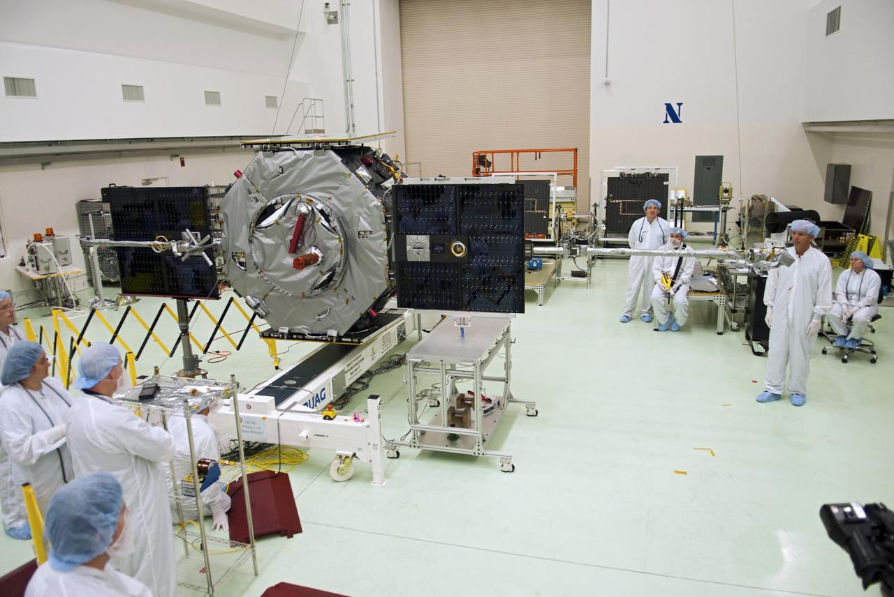 CAPE CANAVERAL, Fla. - Inside the Astrotech payload processing facility near NASA’s Kennedy Space Center in Florida, technicians deploy the solar arrays and magnetometer boom of the Radiation Belt Storm Probes, or RBSP, spacecraft A. Deploying these components is standard procedure to ensure they work properly on Earth before they head into space. NASA’s RBSP mission will help us understand the sun’s influence on Earth and near-Earth space by studying the Earth’s radiation belts on various scales of space and time. As the spacecraft orbits Earth, the four solar panels will continuously face the sun to provide constant power to its instruments. The boom will provide data of the electric fields that energize radiation particles and modify the structure of the inner magnetosphere. RBSP will begin its mission of exploration of Earth’s Van Allen radiation belts and the extremes of space weather after its launch aboard a United Launch Alliance Atlas V rocket. Launch is targeted for Aug. 23. For more information, visit http://www.nasa.gov/rbsp. Photo credit: NASA/Charisse Nahser