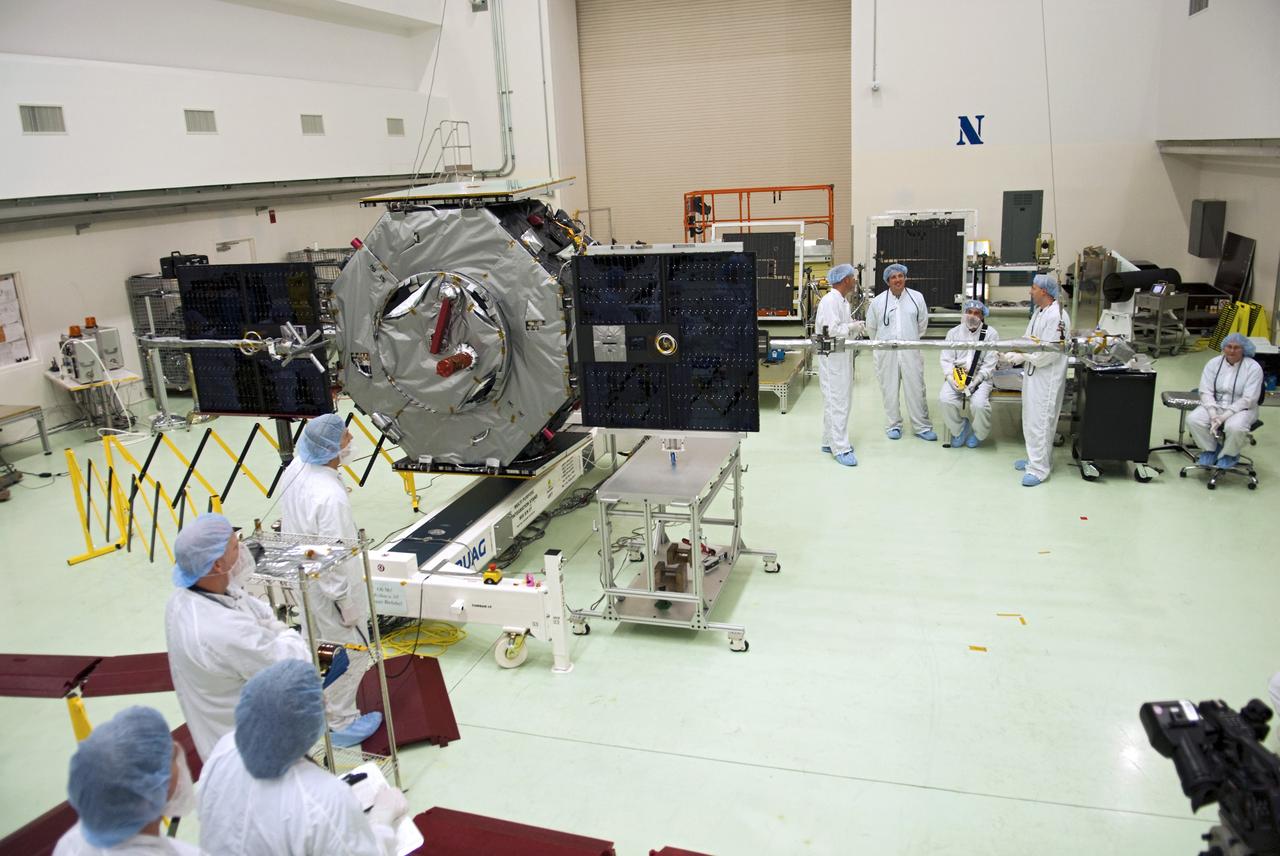 CAPE CANAVERAL, Fla. - Inside the Astrotech payload processing facility near NASA’s Kennedy Space Center in Florida, technicians deploy the solar arrays and magnetometer boom of the Radiation Belt Storm Probes, or RBSP, spacecraft A. Deploying these components is standard procedure to ensure they work properly on Earth before they head into space. NASA’s RBSP mission will help us understand the sun’s influence on Earth and near-Earth space by studying the Earth’s radiation belts on various scales of space and time. As the spacecraft orbits Earth, the four solar panels will continuously face the sun to provide constant power to its instruments. The boom will provide data of the electric fields that energize radiation particles and modify the structure of the inner magnetosphere. RBSP will begin its mission of exploration of Earth’s Van Allen radiation belts and the extremes of space weather after its launch aboard a United Launch Alliance Atlas V rocket. Launch is targeted for Aug. 23. For more information, visit http://www.nasa.gov/rbsp. Photo credit: NASA/Charisse Nahser