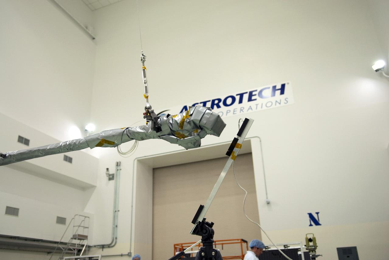 CAPE CANAVERAL, Fla. - Inside the Astrotech payload processing facility near NASA’s Kennedy Space Center in Florida, the magnetometer boom has been deployed on the Radiation Belt Storm Probes, or RBSP, spacecraft A. Deploying the solar arrays and boom are a standard procedure to ensure they work properly on Earth before they head into space. NASA’s RBSP mission will help us understand the sun’s influence on Earth and near-Earth space by studying the Earth’s radiation belts on various scales of space and time. As the spacecraft orbits Earth, the four solar panels will continuously face the sun to provide constant power to its instruments. The boom will provide data of the electric fields that energize radiation particles and modify the structure of the inner magnetosphere. RBSP will begin its mission of exploration of Earth’s Van Allen radiation belts and the extremes of space weather after its launch aboard a United Launch Alliance Atlas V rocket. Launch is targeted for Aug. 23. For more information, visit http://www.nasa.gov/rbsp. Photo credit: NASA/Charisse Nahser