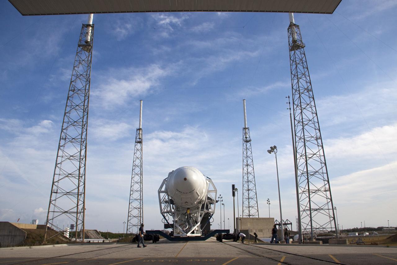 CAPE CANAVERAL, Fla. – In this nose-on view, the SpaceX Falcon 9 rocket arrives at Space Launch Complex-40 on Cape Canaveral Air Force Station in Florida. Liftoff with the SpaceX Dragon capsule aboard is set for 4:55 a.m. EDT on May 19. The launch will be the company's second demonstration test flight for NASA's Commercial Orbital Transportation Services Program, or COTS.    During the flight, the capsule will conduct a series of check-out procedures to test and prove its systems, including rendezvous and berthing with the International Space Station. If the capsule performs as planned, the cargo and experiments it is carrying will be transferred to the station. The cargo includes food, water and provisions for the station’s Expedition crews, such as clothing, batteries and computer equipment. Under COTS, NASA has partnered with two aerospace companies to deliver cargo to the station. For more information, visit http://www.nasa.gov/spacex Photo credit: NASA/Jim Grossmann