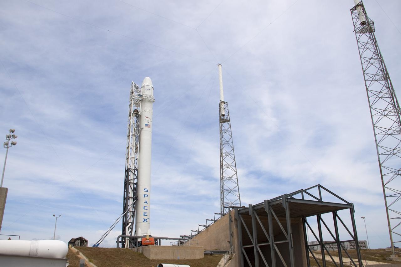 CAPE CANAVERAL, Fla. – The SpaceX Falcon 9 rocket stands at Space Launch Complex-40 on Cape Canaveral Air Force Station in Florida. Liftoff with the SpaceX Dragon capsule aboard is set for 4:55 a.m. EDT on May 19. The launch will be the company's second demonstration test flight for NASA's Commercial Orbital Transportation Services Program, or COTS.    During the flight, the capsule will conduct a series of check-out procedures to test and prove its systems, including rendezvous and berthing with the International Space Station. If the capsule performs as planned, the cargo and experiments it is carrying will be transferred to the station. The cargo includes food, water and provisions for the station’s Expedition crews, such as clothing, batteries and computer equipment. Under COTS, NASA has partnered with two aerospace companies to deliver cargo to the station. For more information, visit http://www.nasa.gov/spacex Photo credit: NASA/Jim Grossmann