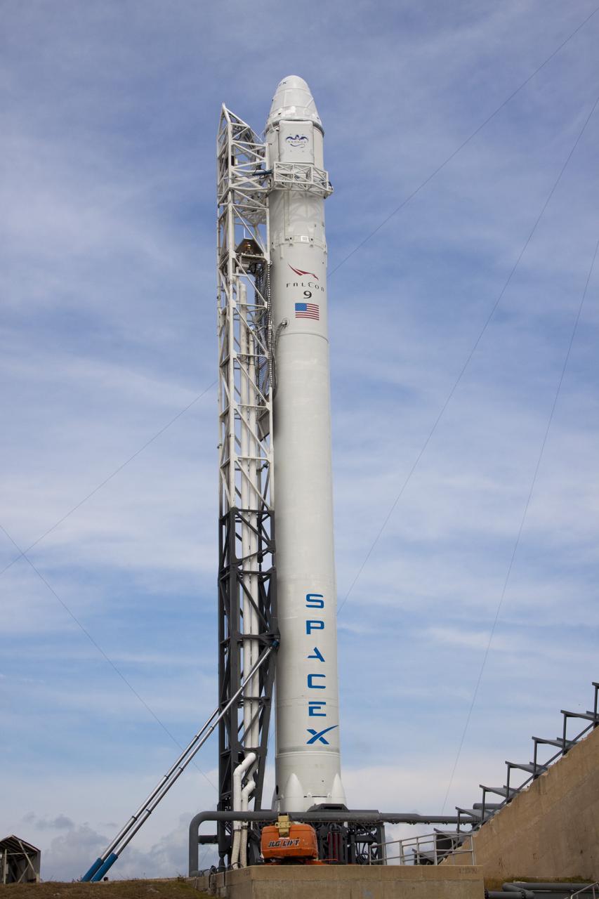 CAPE CANAVERAL, Fla. – The SpaceX Falcon 9 rocket stands at Space Launch Complex-40 on Cape Canaveral Air Force Station in Florida. Liftoff with the SpaceX Dragon capsule aboard is set for 4:55 a.m. EDT on May 19. The launch will be the company's second demonstration test flight for NASA's Commercial Orbital Transportation Services Program, or COTS.    During the flight, the capsule will conduct a series of check-out procedures to test and prove its systems, including rendezvous and berthing with the International Space Station. If the capsule performs as planned, the cargo and experiments it is carrying will be transferred to the station. The cargo includes food, water and provisions for the station’s Expedition crews, such as clothing, batteries and computer equipment. Under COTS, NASA has partnered with two aerospace companies to deliver cargo to the station. For more information, visit http://www.nasa.gov/spacex Photo credit: NASA/Jim Grossmann