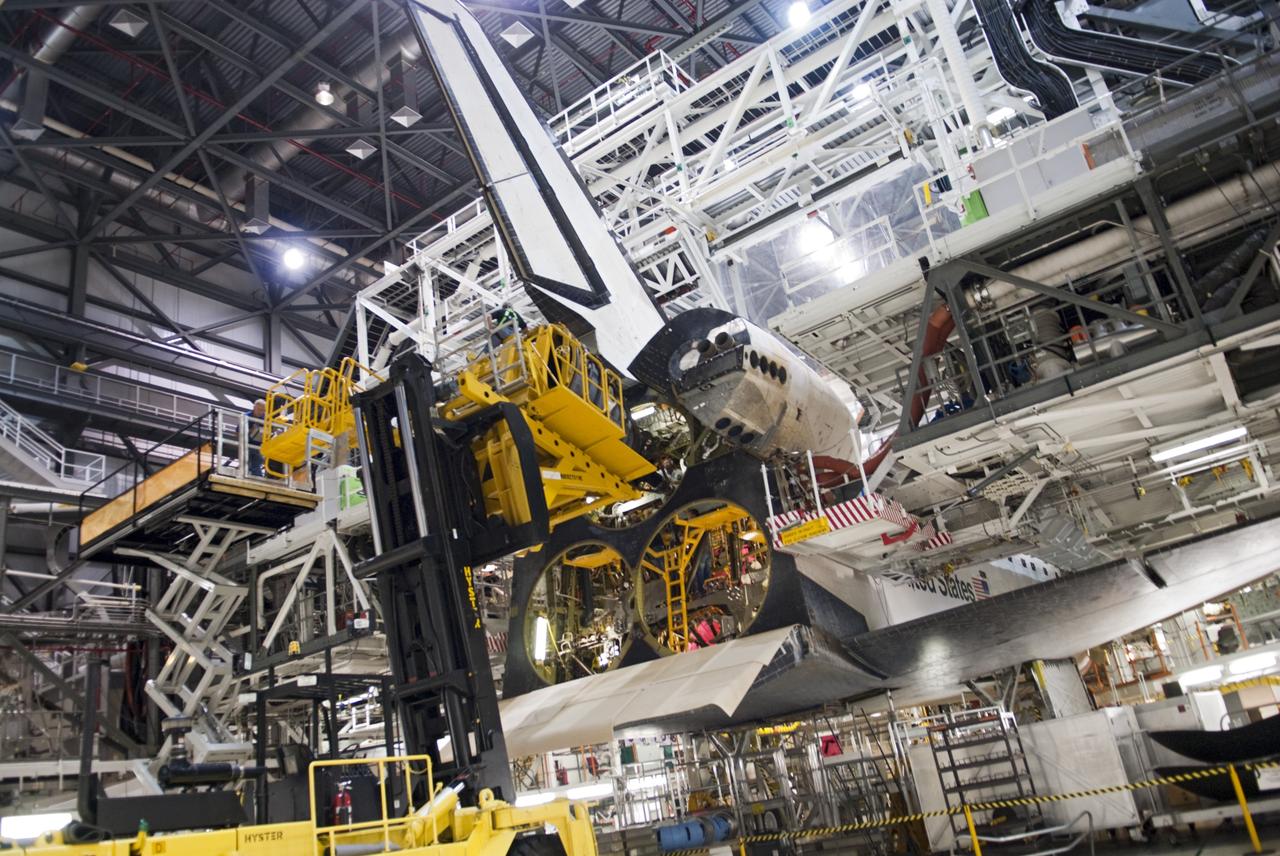 CAPE CANAVERAL, Fla. – In Orbiter Processing Facility Bay 2 at NASA’s Kennedy Space Center in Florida, technicians use the Hyster forklift to install replica shuttle main engine RSME number 1 on the space shuttle Endeavour. The orbiter is surrounded by work platforms allowing access to all areas of the spacecraft.    The work is part of Transition and Retirement of the remaining space shuttles, Endeavour and Atlantis. Endeavour is being prepared for public display at the California Science Center in Los Angeles. Its ferry flight to California is targeted for mid-September. Endeavour was the last space shuttle added to NASA’s orbiter fleet. Over the course of its 19-year career, Endeavour spent 299 days in space during 25 missions. For more information, visit http://www.nasa.gov/transition Photo credit: NASA/Charisse Nahser