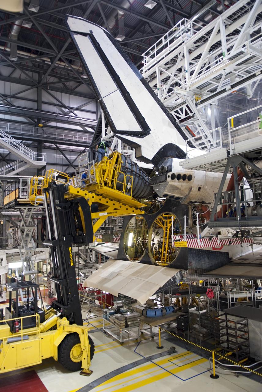 CAPE CANAVERAL, Fla. – In Orbiter Processing Facility Bay 2 at NASA’s Kennedy Space Center in Florida, technicians use the Hyster forklift to install replica shuttle main engine RSME number 1 on the space shuttle Endeavour.      The work is part of Transition and Retirement of the remaining space shuttles, Endeavour and Atlantis. Endeavour is being prepared for public display at the California Science Center in Los Angeles. Its ferry flight to California is targeted for mid-September. Endeavour was the last space shuttle added to NASA’s orbiter fleet. Over the course of its 19-year career, Endeavour spent 299 days in space during 25 missions. For more information, visit http://www.nasa.gov/transition Photo credit: NASA/Charisse Nahser