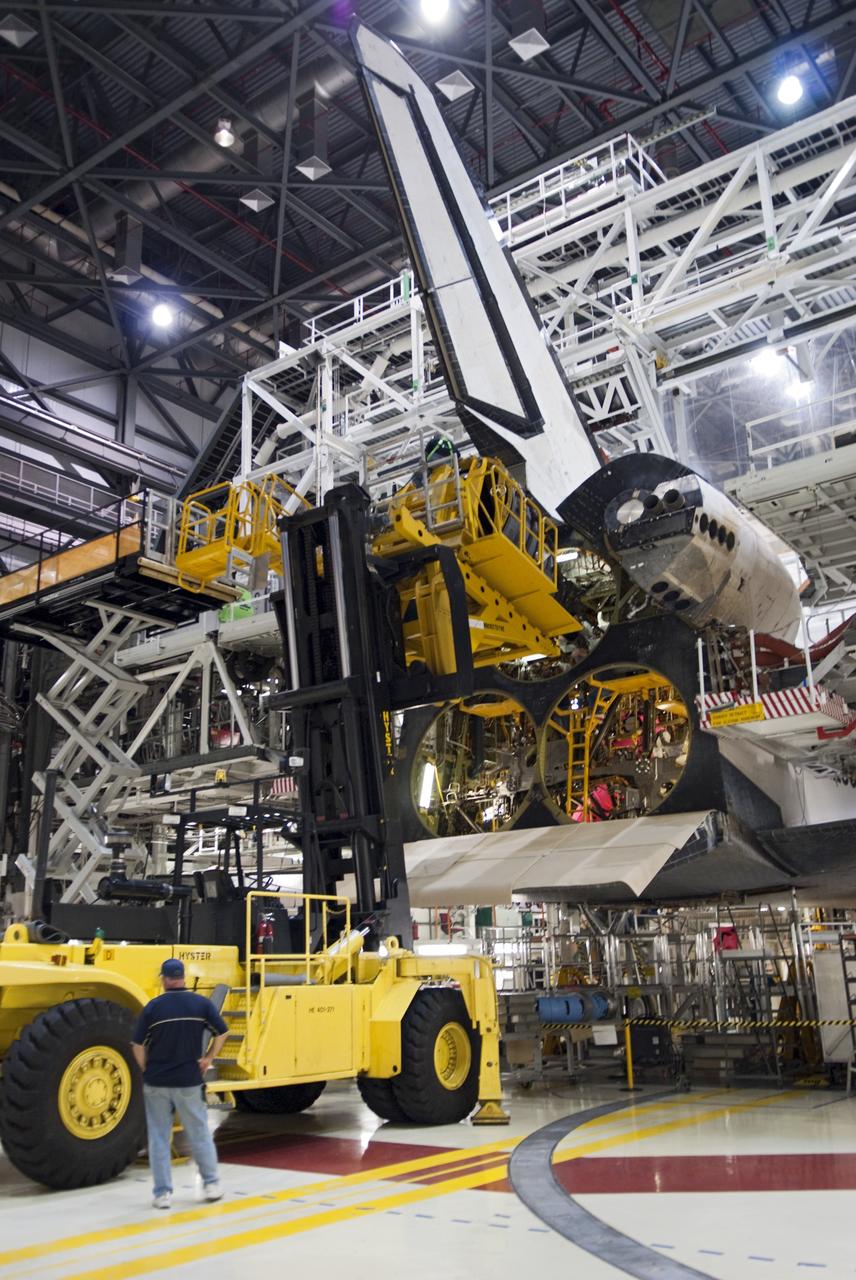 CAPE CANAVERAL, Fla. – In Orbiter Processing Facility Bay 2 at NASA’s Kennedy Space Center in Florida, technicians use the Hyster forklift to install replica shuttle main engine RSME number 1 on the space shuttle Endeavour. The work is part of Transition and Retirement of the remaining space shuttles, Endeavour and Atlantis. Endeavour is being prepared for public display at the California Science Center in Los Angeles. Its ferry flight to California is targeted for mid-September. Endeavour was the last space shuttle added to NASA’s orbiter fleet. Over the course of its 19-year career, Endeavour spent 299 days in space during 25 missions. For more information, visit http://www.nasa.gov/transition Photo credit: NASA/Charisse Nahser