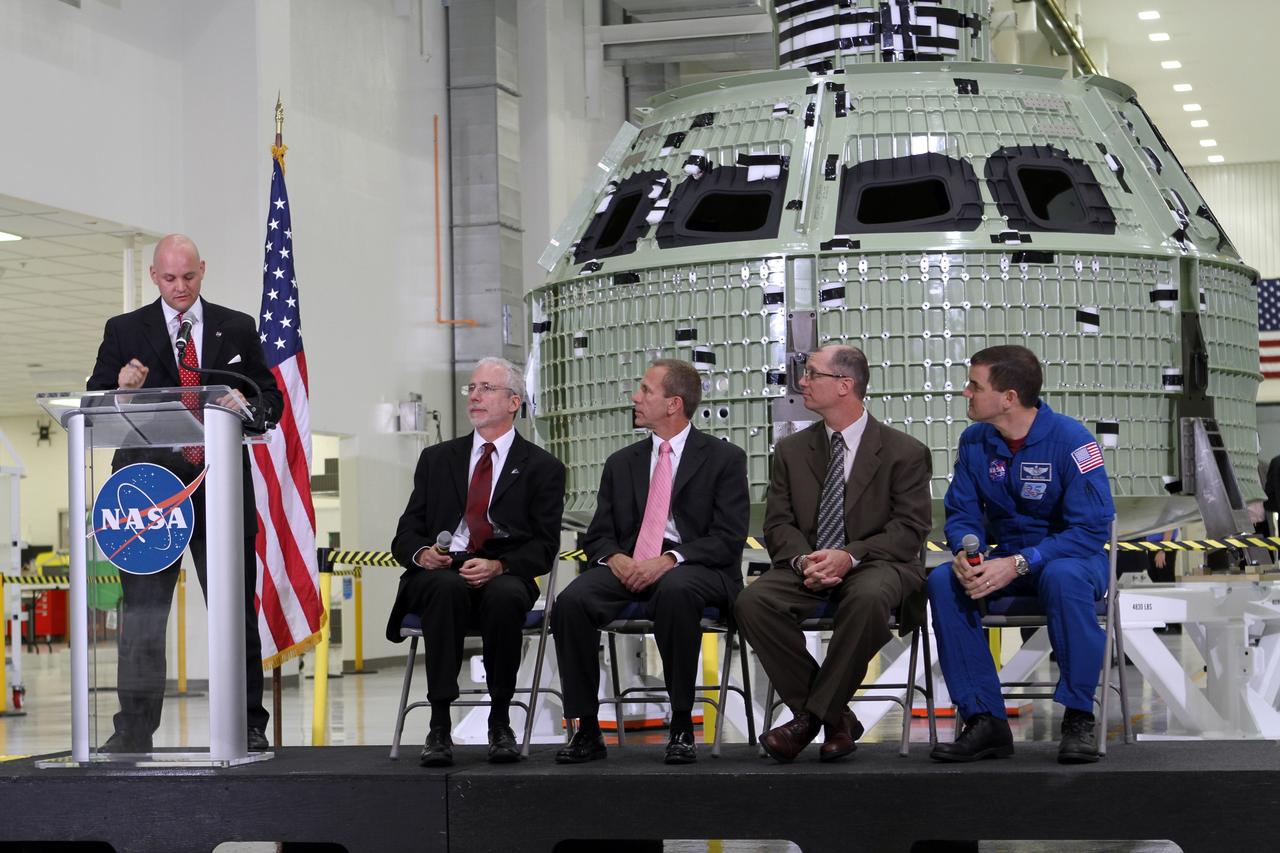 CAPE CANAVERAL, Fla. – Trent Perrotto of NASA Public Affairs addresses an audience of participants during a NASA social question and answer session. The group is assembled in Kennedy Space Center's Operations and Checkout Building high bay for an event marking the arrival of NASA's first space-bound Orion capsule in Florida. Joining Perrotto on stage, from the left, are Mark Geyer, Orion program manager David Beaman, NASA Space Launch System spacecraft and payload integration manager Pepper Phillips, program manager for NASA's Ground Systems Development and Operations and NASA astronaut Rex Walheim.      The tweeters will share their experiences with followers through the social networking site Twitter. Slated for Exploration Flight Test-1, an uncrewed mission planned for 2014, the capsule will travel farther into space than any human spacecraft has gone in more than 40 years. NASA's Michoud Assembly Facility in New Orleans built the crew module pressure vessel. The Orion production team will prepare the module for flight by installing heat-shielding thermal protection systems, avionics and other subsystems. For more information, visit http://www.nasa.gov/orion Photo credit: NASA/Kim Shiflett