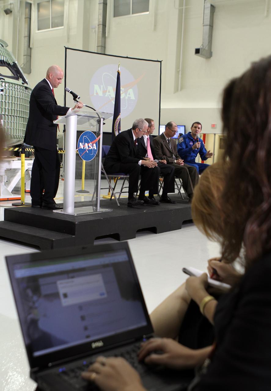 CAPE CANAVERAL, Fla. – NASA astronaut Rex Walheim, far right, addresses an participants during a NASA social question and answer session. The group is assembled in Kennedy Space Center's Operations and Checkout Building high bay for an event marking the arrival of NASA's first space-bound Orion capsule in Florida. At the podium is Trent Perrotto of NASA Public Affairs. Joining Perrotto on stage, from the left, are Mark Geyer, Orion program manager David Beaman, NASA Space Launch System spacecraft and payload integration manager Pepper Phillips, program manager for NASA's Ground Systems Development and Operations and Walheim.      The tweeters will share their experiences with followers through the social networking site Twitter. Slated for Exploration Flight Test-1, an uncrewed mission planned for 2014, the capsule will travel farther into space than any human spacecraft has gone in more than 40 years. NASA's Michoud Assembly Facility in New Orleans built the crew module pressure vessel. The Orion production team will prepare the module for flight by installing heat-shielding thermal protection systems, avionics and other subsystems. For more information, visit http://www.nasa.gov/orion Photo credit: NASA/Kim Shiflett