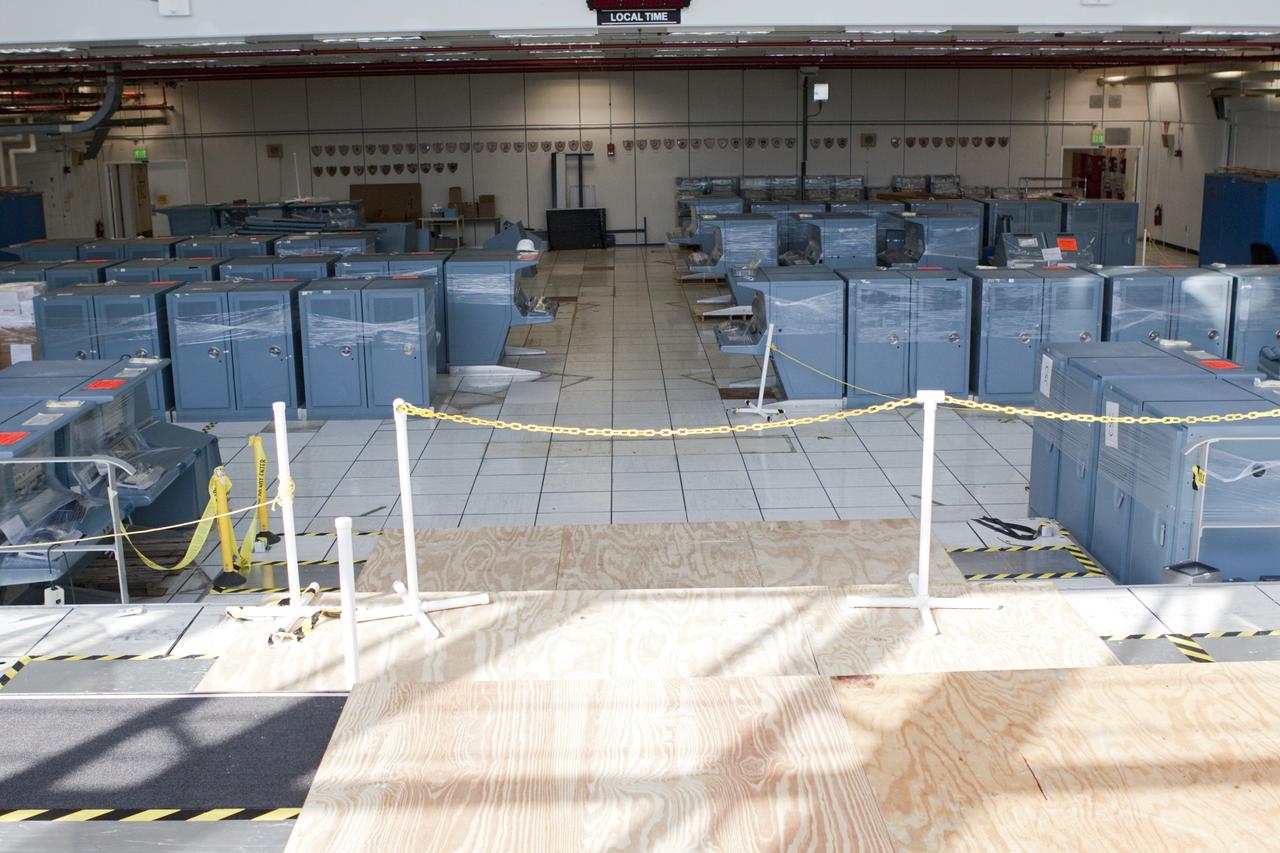 CAPE CANAVERAL, Fla. - In Firing Room 3 of the Launch Control Center at NASA’s Kennedy Space Center in Florida, legacy consoles and monitors are being removed to make way for new systems designed to be flexible so controllers can process and launch multiple types of rockets and spacecraft, whether they are government or commercial models.      KSC’s Launch Complex 39 is transitioning to support multiple users with the Firing Rooms being modified to be more generic in nature for upcoming programs. Photo credit: NASA/Jim Grossmann