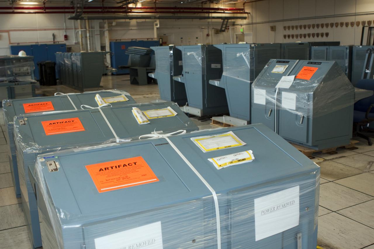 CAPE CANAVERAL, Fla. - In Firing Room 3 of the Launch Control Center at NASA’s Kennedy Space Center in Florida, legacy consoles and monitors are being removed to make way for new systems designed to be flexible so controllers can process and launch multiple types of rockets and spacecraft, whether they are government or commercial models. The historical nature of the consoles is marked with an “artifact” label as some will be displayed in museums and other educational institutions.      KSC’s Launch Complex 39 is transitioning to support multiple users with the Firing Rooms being modified to be more generic in nature for upcoming programs. Photo credit: NASA/Jim Grossmann