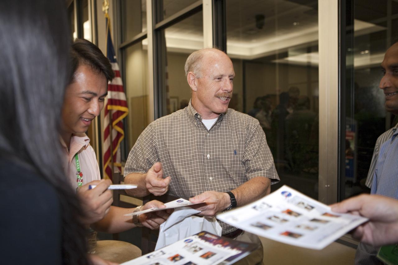 CAPE CANAVERAL, Fla. – Former NASA astronaut Ken Bowersox signs autographs and talks with participants of the International Space University during a panel discussion on the future of human spaceflight at the Kennedy Space Center Visitor Complex in Florida.     The International Space University is a nine-week intensive course designed for post-graduate university students and professionals during the summer. The program is hosted by a different country each year, providing a unique educational experience for participants from around the world. NASA Kennedy Space Center and the Florida Institute of Technology in Melbourne, Fla., are co-hosting this year’s event which runs from June 4 to Aug. 3. There are about 125 participants representing 31 countries. For more information, visit http://www.isunet.edu. Photo credit: NASA/Kim Shiflett