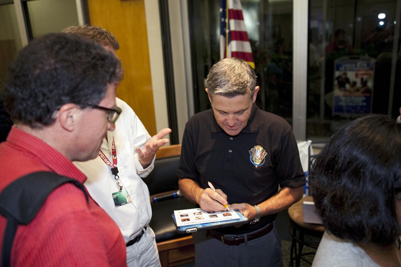 CAPE CANAVERAL, Fla. – Kennedy Space Center Director and former NASA astronaut Bob Cabana signs autographs and talks with participants of the International Space University during a panel discussion on the future of human spaceflight at the Kennedy Space Center Visitor Complex in Florida.     The International Space University is a nine-week intensive course designed for post-graduate university students and professionals during the summer. The program is hosted by a different country each year, providing a unique educational experience for participants from around the world. NASA Kennedy Space Center and the Florida Institute of Technology in Melbourne, Fla., are co-hosting this year’s event which runs from June 4 to Aug. 3. There are about 125 participants representing 31 countries. For more information, visit http://www.isunet.edu. Photo credit: NASA/Kim Shiflett