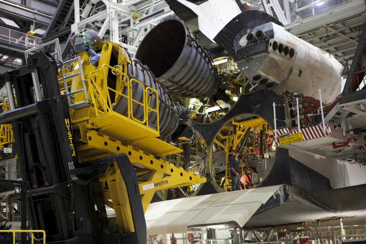 CAPE CANAVERAL, Fla. – In Orbiter Processing Facility Bay 2 at NASA’s Kennedy Space Center in Florida, technicians move the Hyster forklift into position for installation of replica shuttle main engine RSME number 3 on the space shuttle Endeavour. The work is part of Transition and Retirement of the remaining space shuttles, Endeavour and Atlantis. Endeavour is being prepared for public display at the California Science Center in Los Angeles. Its ferry flight to California is targeted for mid-September. Endeavour was the last space shuttle added to NASA’s orbiter fleet. Over the course of its 19-year career, Endeavour spent 299 days in space during 25 missions. For more information, visit http://www.nasa.gov/transition Photo credit: NASA/ Dimitri Gerondidakis
