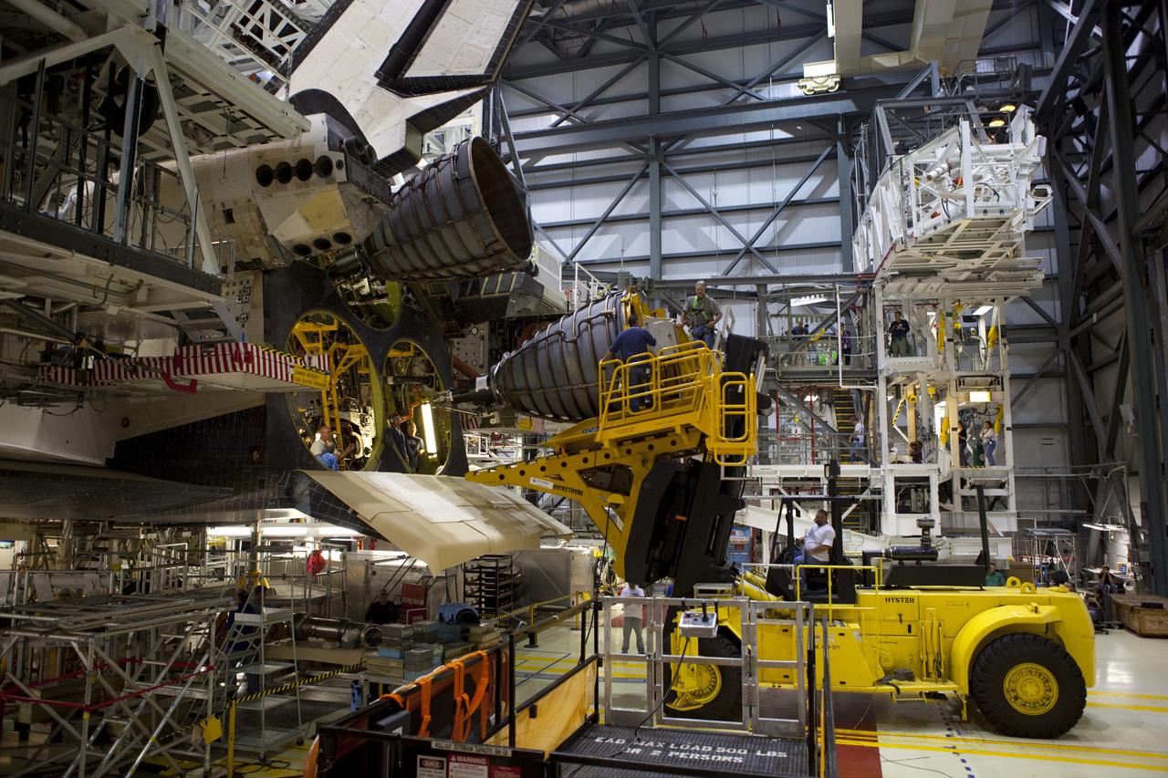 CAPE CANAVERAL, Fla. – In Orbiter Processing Facility Bay 1 at NASA’s Kennedy Space Center in Florida, technicians work with the Hyster forklift as replica shuttle main engine RSME number 3 is installed on the space shuttle Endeavour.      The work is part of Transition and Retirement of the remaining space shuttles, Endeavour and Atlantis. Endeavour is being prepared for public display at the California Science Center in Los Angeles. Its ferry flight to California is targeted for mid-September. Endeavour was the last space shuttle added to NASA’s orbiter fleet. Over the course of its 19-year career, Endeavour spent 299 days in space during 25 missions. For more information, visit http://www.nasa.gov/transition Photo credit: NASA/ Dimitri Gerondidakis