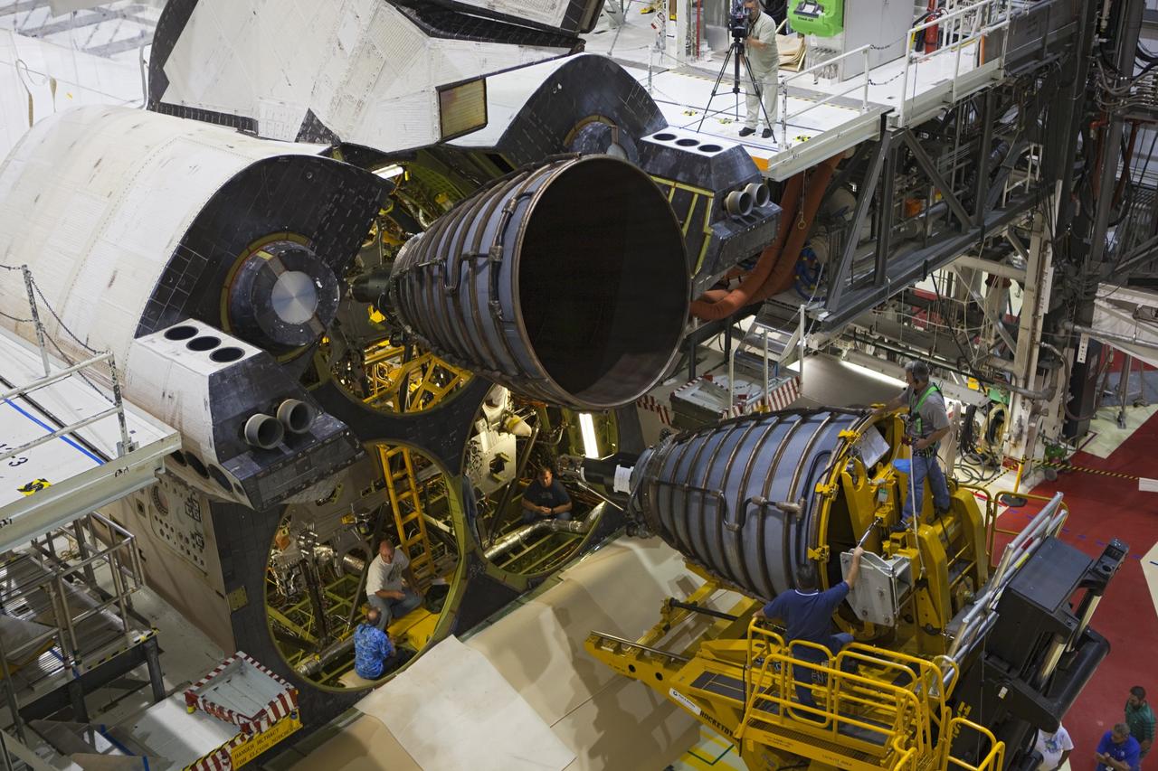 CAPE CANAVERAL, Fla. – In an overhead view, technicians work inside the aft compartment of the space shuttle Endeavour during installation of replica shuttle main engine RSME number 3 in Orbiter Processing Facility Bay 2 at NASA’s Kennedy Space Center in Florida. The work is part of Transition and Retirement of the remaining space shuttles, Endeavour and Atlantis. Endeavour is being prepared for public display at the California Science Center in Los Angeles. Its ferry flight to California is targeted for mid-September. Endeavour was the last space shuttle added to NASA’s orbiter fleet. Over the course of its 19-year career, Endeavour spent 299 days in space during 25 missions. For more information, visit http://www.nasa.gov/transition Photo credit: NASA/ Dimitri Gerondidakis