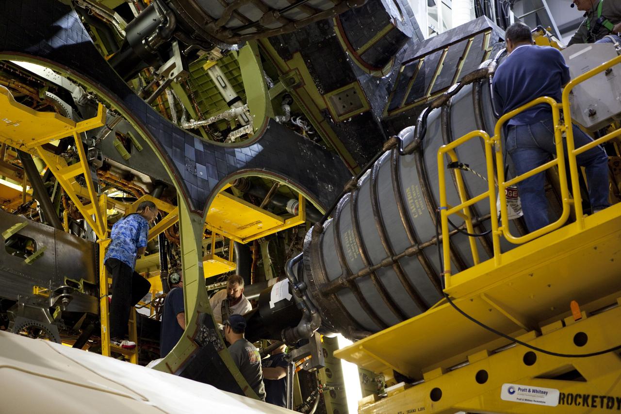 CAPE CANAVERAL, Fla. – Inside Orbiter Processing Facility Bay 2 at NASA’s Kennedy Space Center in Florida, technicians work inside the aft compartment of the space shuttle Endeavour as replica shuttle main engine RSME number 3 is installed on the space shuttle Endeavour. The work is part of Transition and Retirement of the remaining space shuttles, Endeavour and Atlantis. Endeavour is being prepared for public display at the California Science Center in Los Angeles. Its ferry flight to California is targeted for mid-September. Endeavour was the last space shuttle added to NASA’s orbiter fleet. Over the course of its 19-year career, Endeavour spent 299 days in space during 25 missions. For more information, visit http://www.nasa.gov/transition Photo credit: NASA/ Dimitri Gerondidakis