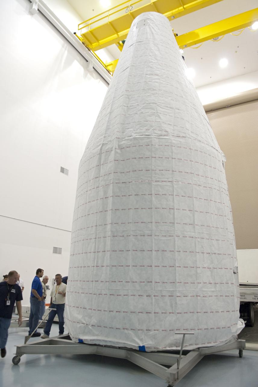 CAPE CANAVERAL, Fla. - Inside the Astrotech payload processing facility near NASA’s Kennedy Space Center in Florida, technicians offload, inspect and prepare to uncover the nose cone fairing for the Radiation Belt Storm Probes, or RBSP, spacecraft. The nose faring will house and protect the RBSP during liftoff aboard an Atlas V rocket. NASA’s RBSP mission will help us understand the sun’s influence on Earth and near-Earth space by studying the Earth’s radiation belts on various scales of space and time. RBSP will begin its mission of exploration of Earth’s Van Allen radiation belts and the extremes of space weather after its liftoff aboard a United Launch Alliance Atlas V from Space Launch Complex 41 at Cape Canaveral Air Force Station, Fla. Liftoff is targeted for Aug. 23, 2012. For more information, visit http://www.nasa.gov/rbsp. Photo credit: NASA/Charisse Nahser