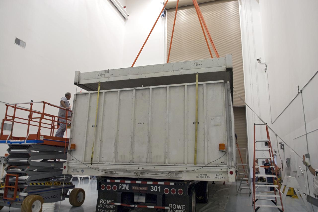 CAPE CANAVERAL, Fla. - Inside the Astrotech payload processing facility near NASA’s Kennedy Space Center in Florida, technicians open the shipping crate containing the nose cone fairing for the Radiation Belt Storm Probes, or RBSP, spacecraft. The nose faring will house and protect the RBSP during liftoff aboard an Atlas V rocket. NASA’s RBSP mission will help us understand the sun’s influence on Earth and near-Earth space by studying the Earth’s radiation belts on various scales of space and time. RBSP will begin its mission of exploration of Earth’s Van Allen radiation belts and the extremes of space weather after its liftoff aboard a United Launch Alliance Atlas V from Space Launch Complex 41 at Cape Canaveral Air Force Station, Fla. Liftoff is targeted for Aug. 23, 2012. For more information, visit http://www.nasa.gov/rbsp. Photo credit: NASA/Charisse Nahser