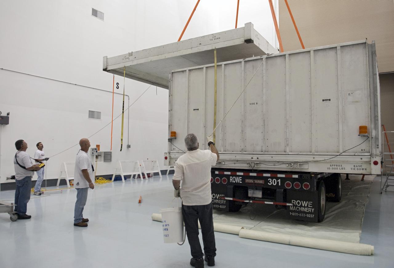 CAPE CANAVERAL, Fla. - Inside the Astrotech payload processing facility near NASA’s Kennedy Space Center in Florida, technicians open the shipping crate containing the nose cone fairing for the Radiation Belt Storm Probes, or RBSP, spacecraft. The nose faring will house and protect the RBSP during liftoff aboard an Atlas V rocket. NASA’s RBSP mission will help us understand the sun’s influence on Earth and near-Earth space by studying the Earth’s radiation belts on various scales of space and time. RBSP will begin its mission of exploration of Earth’s Van Allen radiation belts and the extremes of space weather after its liftoff aboard a United Launch Alliance Atlas V from Space Launch Complex 41 at Cape Canaveral Air Force Station, Fla. Liftoff is targeted for Aug. 23, 2012. For more information, visit http://www.nasa.gov/rbsp. Photo credit: NASA/Charisse Nahser