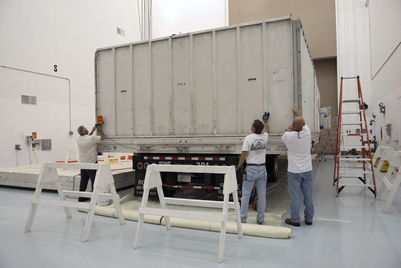CAPE CANAVERAL, Fla. - Inside the Astrotech payload processing facility near NASA’s Kennedy Space Center in Florida, technicians open the shipping crate containing the nose cone fairing for the Radiation Belt Storm Probes, or RBSP, spacecraft. The nose faring will house and protect the RBSP during liftoff aboard an Atlas V rocket. NASA’s RBSP mission will help us understand the sun’s influence on Earth and near-Earth space by studying the Earth’s radiation belts on various scales of space and time. RBSP will begin its mission of exploration of Earth’s Van Allen radiation belts and the extremes of space weather after its liftoff aboard a United Launch Alliance Atlas V from Space Launch Complex 41 at Cape Canaveral Air Force Station, Fla. Liftoff is targeted for Aug. 23, 2012. For more information, visit http://www.nasa.gov/rbsp. Photo credit: NASA/Charisse Nahser