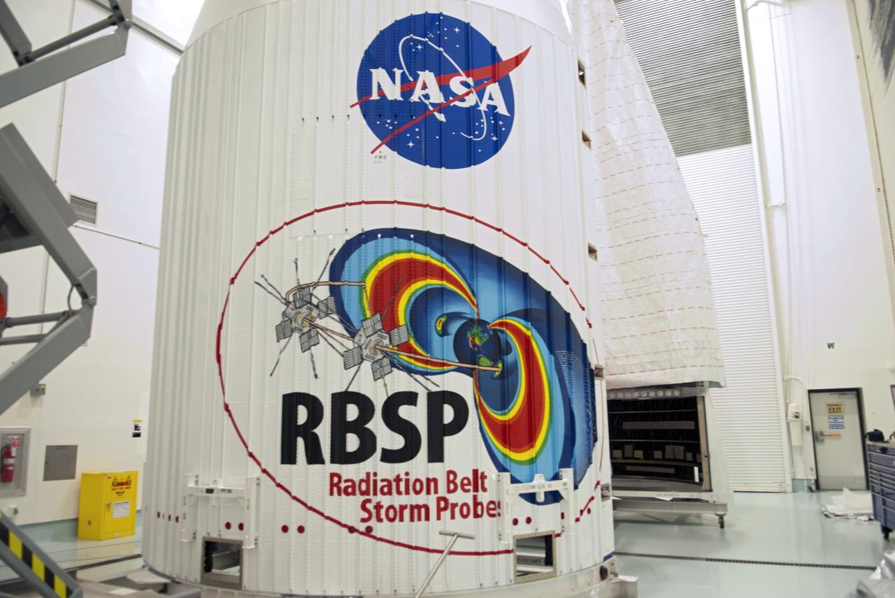 CAPE CANAVERAL, Fla. - Inside the Astrotech payload processing facility near NASA’s Kennedy Space Center in Florida, the nose cone fairing for the Radiation Belt Storm Probes, or RBSP, spacecraft includes an artistic depiction of the probe’s mission. The nose faring will house and protect the RBSP during liftoff aboard an Atlas V rocket. NASA’s RBSP mission will help us understand the sun’s influence on Earth and near-Earth space by studying the Earth’s radiation belts on various scales of space and time. RBSP will begin its mission of exploration of Earth’s Van Allen radiation belts and the extremes of space weather after its liftoff aboard a United Launch Alliance Atlas V from Space Launch Complex 41 at Cape Canaveral Air Force Station, Fla. Liftoff is targeted for Aug. 23, 2012. For more information, visit http://www.nasa.gov/rbsp. Photo credit: NASA/Charisse Nahser