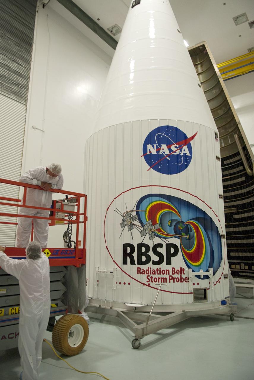 CAPE CANAVERAL, Fla. - Inside the Astrotech payload processing facility near NASA’s Kennedy Space Center in Florida, technicians use a lift to inspect the nose cone fairing for the Radiation Belt Storm Probes, or RBSP, spacecraft. The nose faring will house and protect the RBSP during liftoff aboard an Atlas V rocket. NASA’s RBSP mission will help us understand the sun’s influence on Earth and near-Earth space by studying the Earth’s radiation belts on various scales of space and time. RBSP will begin its mission of exploration of Earth’s Van Allen radiation belts and the extremes of space weather after its liftoff aboard a United Launch Alliance Atlas V from Space Launch Complex 41 at Cape Canaveral Air Force Station, Fla. Liftoff is targeted for Aug. 23, 2012. For more information, visit http://www.nasa.gov/rbsp. Photo credit: NASA/Charisse Nahser