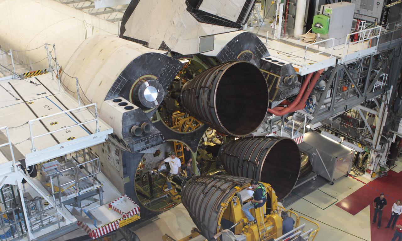 CAPE CANAVERAL, Fla. – Inside Orbiter Processing Facility-2 at NASA’s Kennedy Space Center in Florida, United Space Alliance technicians monitor the progress as a Hyster forklift moves replica shuttle main engine 2, or RSME 2, closer for installation on space shuttle Endeavour. The orbiter is surrounded by work platforms allowing access to all areas of the spacecraft. The work is part of Transition and Retirement of the remaining space shuttles, Endeavour and Atlantis. Endeavour is being prepared for public display at the California Science Center in Los Angeles. Its ferry flight to California is targeted for mid-September. Endeavour was the last space shuttle added to NASA’s orbiter fleet. Over the course of its 19-year career, Endeavour spent 299 days in space during 25 missions. For more information, visit http://www.nasa.gov/shuttle. Photo credit: NASA/David Lee