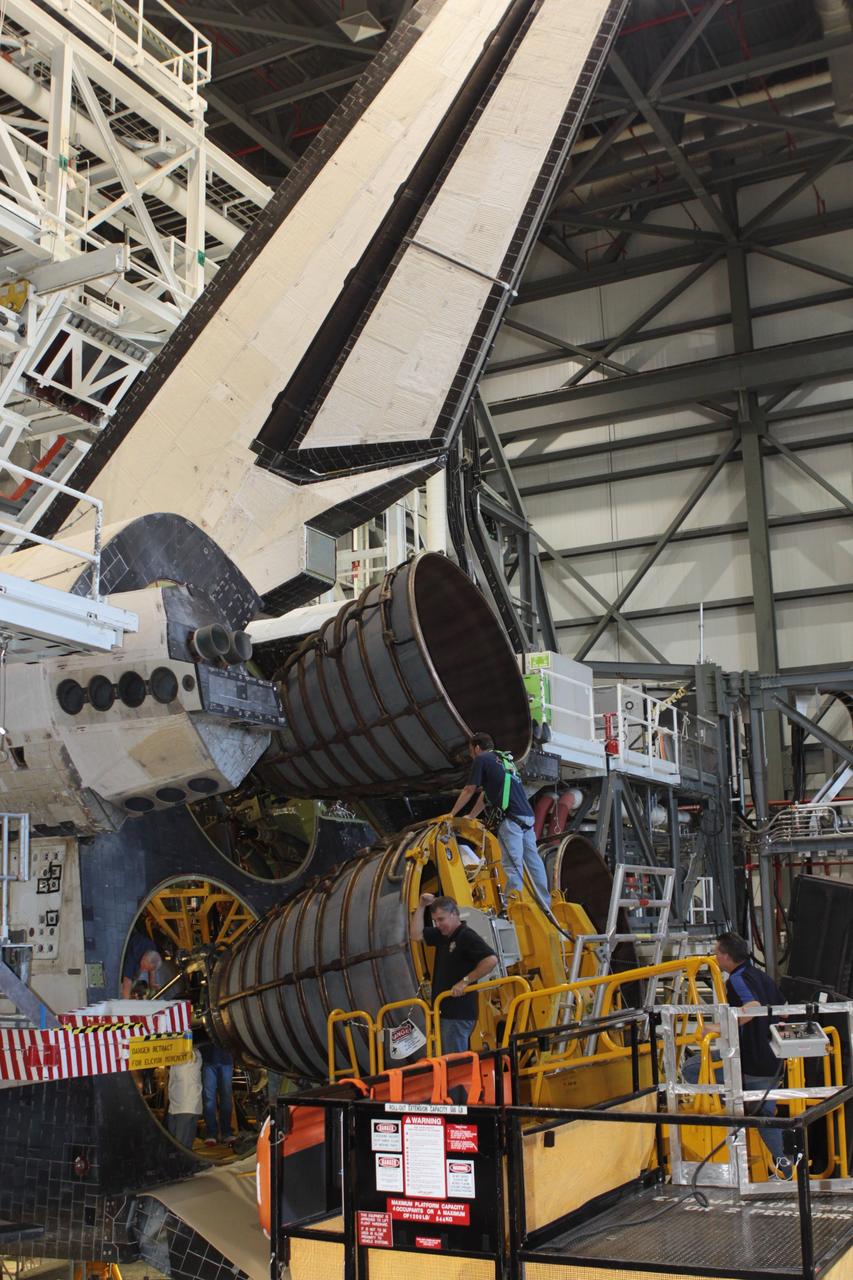 CAPE CANAVERAL, Fla. – Inside Orbiter Processing Facility-2 at NASA’s Kennedy Space Center in Florida, United Space Alliance technicians used a Hyster forklift to guide replica shuttle main engine 2, or RSME 2, closer for installation on space shuttle Endeavour. The orbiter is surrounded by work platforms allowing access to all areas of the spacecraft. The work is part of Transition and Retirement of the remaining space shuttles, Endeavour and Atlantis. Endeavour is being prepared for public display at the California Science Center in Los Angeles. Its ferry flight to California is targeted for mid-September. Endeavour was the last space shuttle added to NASA’s orbiter fleet. Over the course of its 19-year career, Endeavour spent 299 days in space during 25 missions. For more information, visit http://www.nasa.gov/shuttle. Photo credit: NASA/David Lee