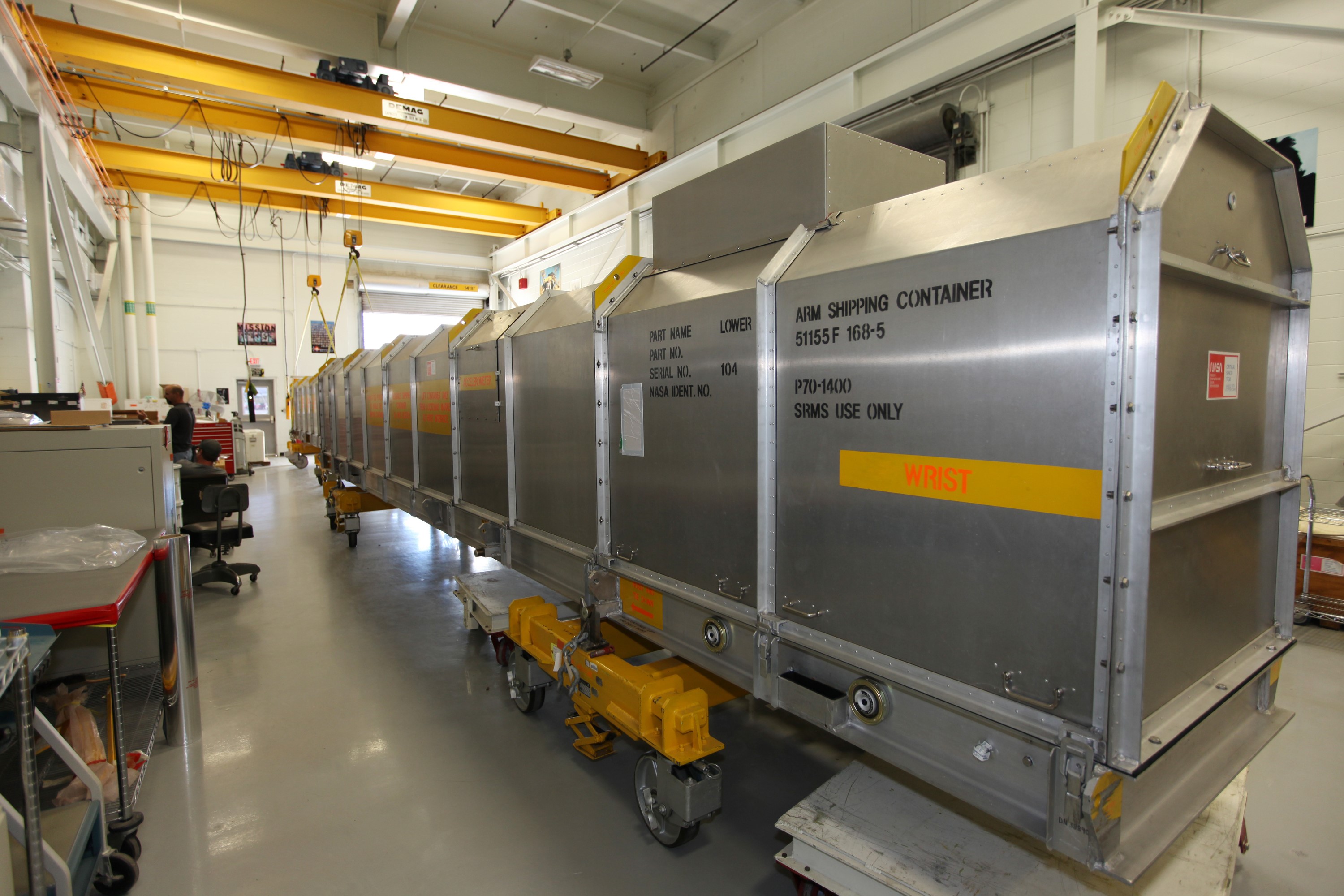 CAPE CANAVERAL, Fla. - Inside the Vehicle Assembly Building at NASA’s Kennedy Space Center in Florida, the remote manipulator system, or RMS, has been crated and prepared for shipment back to the Canadian Space Agency. The RMS, also called the Canadarm, was manufactured for NASA’s Space Shuttle Program by SPAR Aerospace Ltd., which later became a part of MD Robotics in Ontario, Canada. During shuttle missions, the RMS was attached in the payload bay. Mission specialists operated the arm to remove payloads from the payload bay and hand them off to the larger Canadarm 2 on the International Space Station. The shuttle arm also was used during astronaut spacewalks. Photo credit: NASA/Kim Shiflett