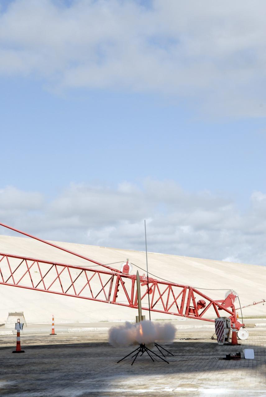 CAPE CANAVERAL, Fla. – A model rocket built by students of the International Space University launches during the rocket launch competition of the ISU's summer session. The competition was conducted at Launch Complex 39A at NASA's Kennedy Space Center in Florida, which co-hosted this year's ISU. Six teams designed and built large model rockets, each between three and five feet tall, and launched them from Launch Pad 39A, the starting point for Apollo missions to the moon and dozens of space shuttle flights. Each launch carried a raw egg, dubbed "eggstronauts" and had to recover it intact to be declared successful. Photo credit: NASA/Charisse Nahsser