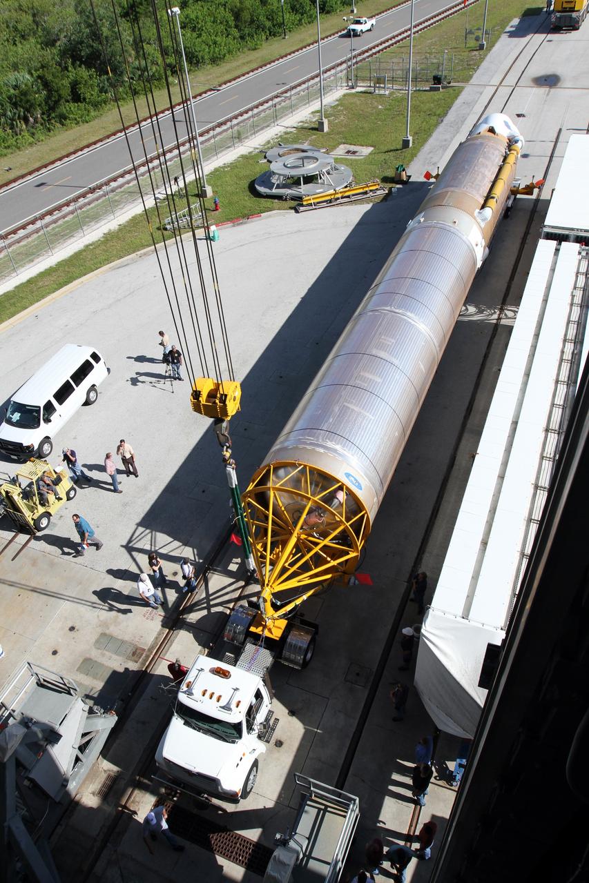 CAPE CANAVERAL, Fla. - A unique aerial view shows the arrival of the first stage of the United Launch Alliance Atlas V rocket at Launch Complex 41 at Cape Canaveral Air Force Station in Florida for the Radiation Belt Storm Probes, or RBSP, mission. NASA’s RBSP mission will help us understand the sun’s influence on Earth and near-Earth space by studying the Earth’s radiation belts on various scales of space and time. RBSP will begin its mission of exploration of Earth’s Van Allen radiation belts and the extremes of space weather after its launch aboard an Atlas V rocket. Launch is targeted for Aug. 23. For more information, visit http://www.nasa.gov/rbsp. Photo credit: NASA/Cory Huston