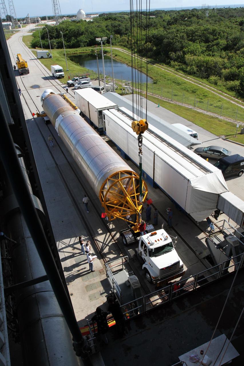 CAPE CANAVERAL, Fla. - A unique aerial view shows the arrival of the first stage of the United Launch Alliance Atlas V rocket at Launch Complex 41 at Cape Canaveral Air Force Station in Florida for the Radiation Belt Storm Probes, or RBSP, mission. NASA’s RBSP mission will help us understand the sun’s influence on Earth and near-Earth space by studying the Earth’s radiation belts on various scales of space and time. RBSP will begin its mission of exploration of Earth’s Van Allen radiation belts and the extremes of space weather after its launch aboard an Atlas V rocket. Launch is targeted for Aug. 23. For more information, visit http://www.nasa.gov/rbsp. Photo credit: NASA/Cory Huston