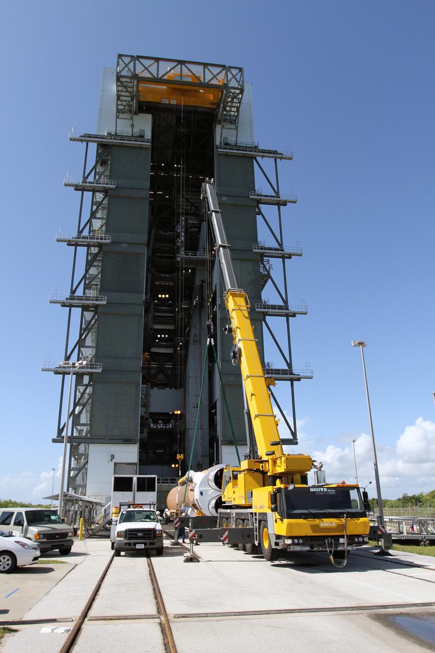 CAPE CANAVERAL, Fla. - At Launch Complex 41 at Cape Canaveral Air Force Station in Florida, preparations are underway to lift the first stage of the United Launch Alliance Atlas V rocket into the vertical position. The Atlas V is being prepared for the Radiation Belt Storm Probes, or RBSP, mission.    NASA’s RBSP mission will help us understand the sun’s influence on Earth and near-Earth space by studying the Earth’s radiation belts on various scales of space and time. RBSP will begin its mission of exploration of Earth’s Van Allen radiation belts and the extremes of space weather after its launch aboard an Atlas V rocket. Launch is targeted for Aug. 23. For more information, visit http://www.nasa.gov/rbsp. Photo credit: NASA/Cory Huston