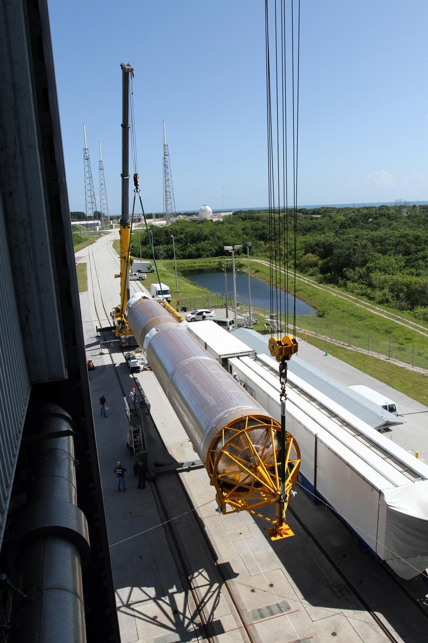 CAPE CANAVERAL, Fla. - At Launch Complex 41 at Cape Canaveral Air Force Station in Florida, technicians monitor the progress as a large crane begins to lift the first stage of the United Launch Alliance Atlas V rocket into the vertical position. The Atlas V is being prepared for the Radiation Belt Storm Probes, or RBSP, mission. NASA’s RBSP mission will help us understand the sun’s influence on Earth and near-Earth space by studying the Earth’s radiation belts on various scales of space and time. RBSP will begin its mission of exploration of Earth’s Van Allen radiation belts and the extremes of space weather after its launch aboard an Atlas V rocket. Launch is targeted for Aug. 23. For more information, visit http://www.nasa.gov/rbsp. Photo credit: NASA/Cory Huston